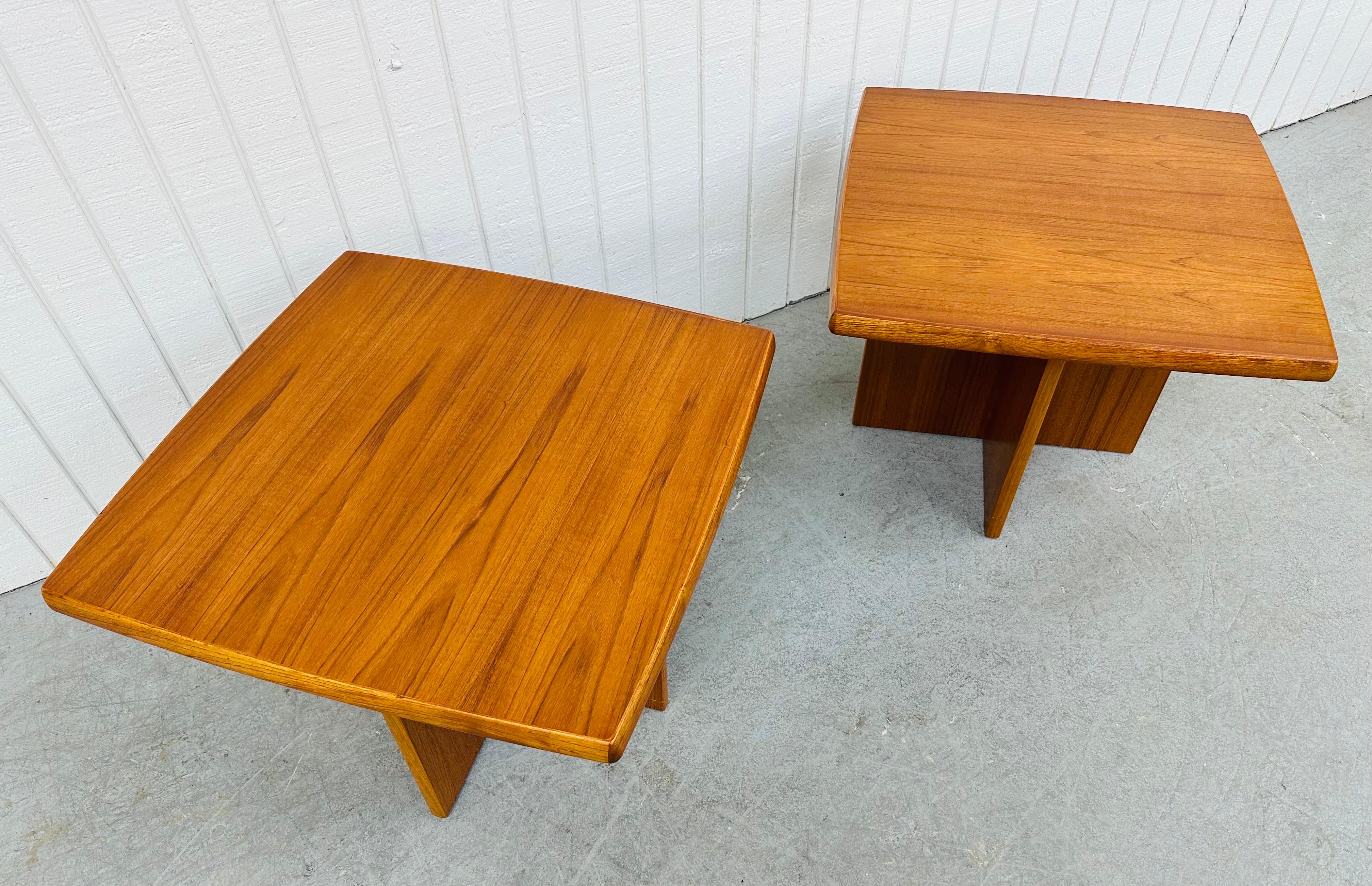 This listing is for a pair of vintage Danish Modern Teak Side Tables. Featuring a straight line square top design, cross pedestal base, and a beautiful teak finish. This is an exceptional combination of quality and design made in Denmark!