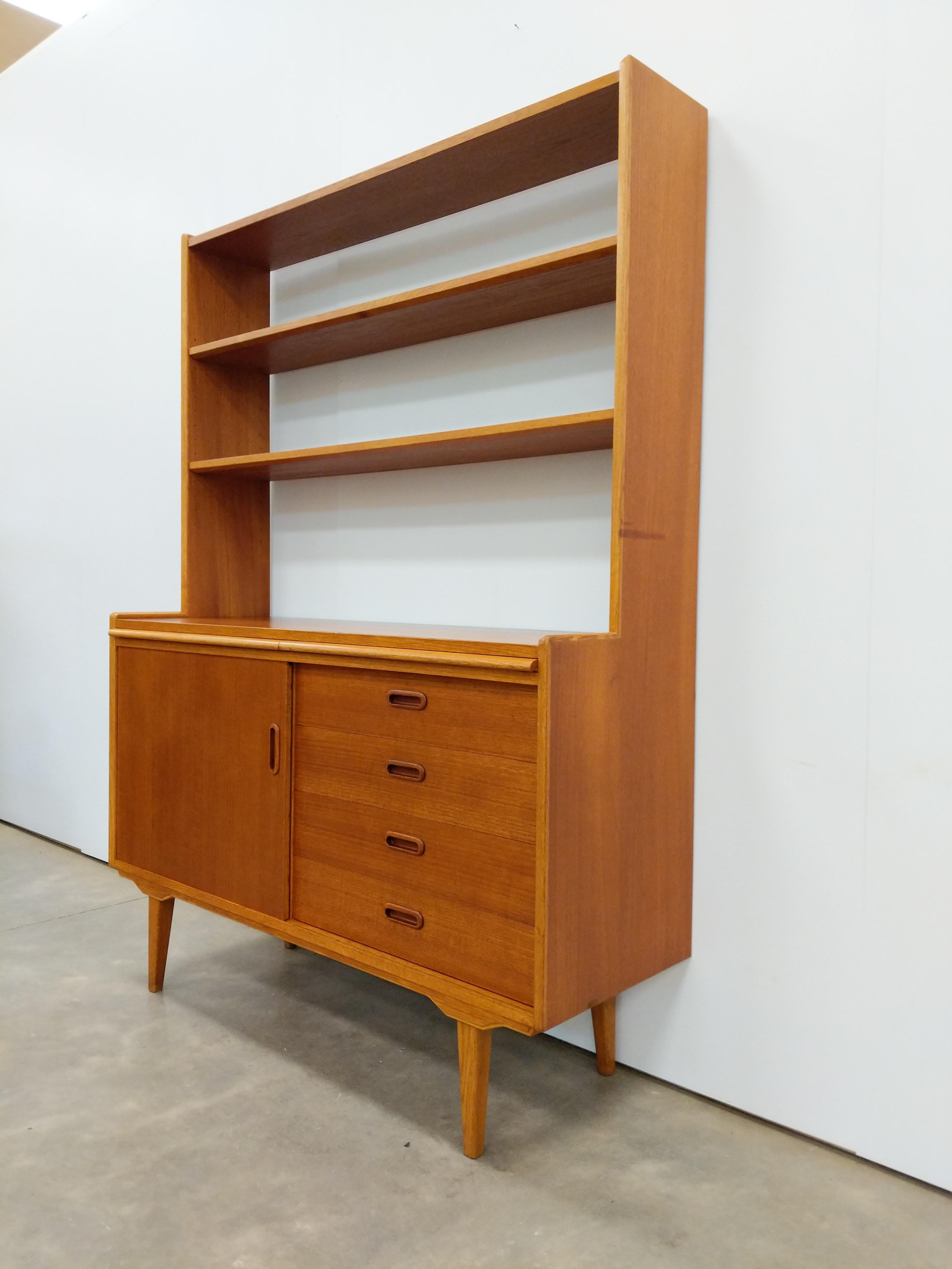 Authentic vintage mid century Danish / Scandinavian Modern teak sideboard secretary desk / cabinet / server.

This piece is in excellent condition with very few signs of age-related wear (see photos).

If you would like any additional details,