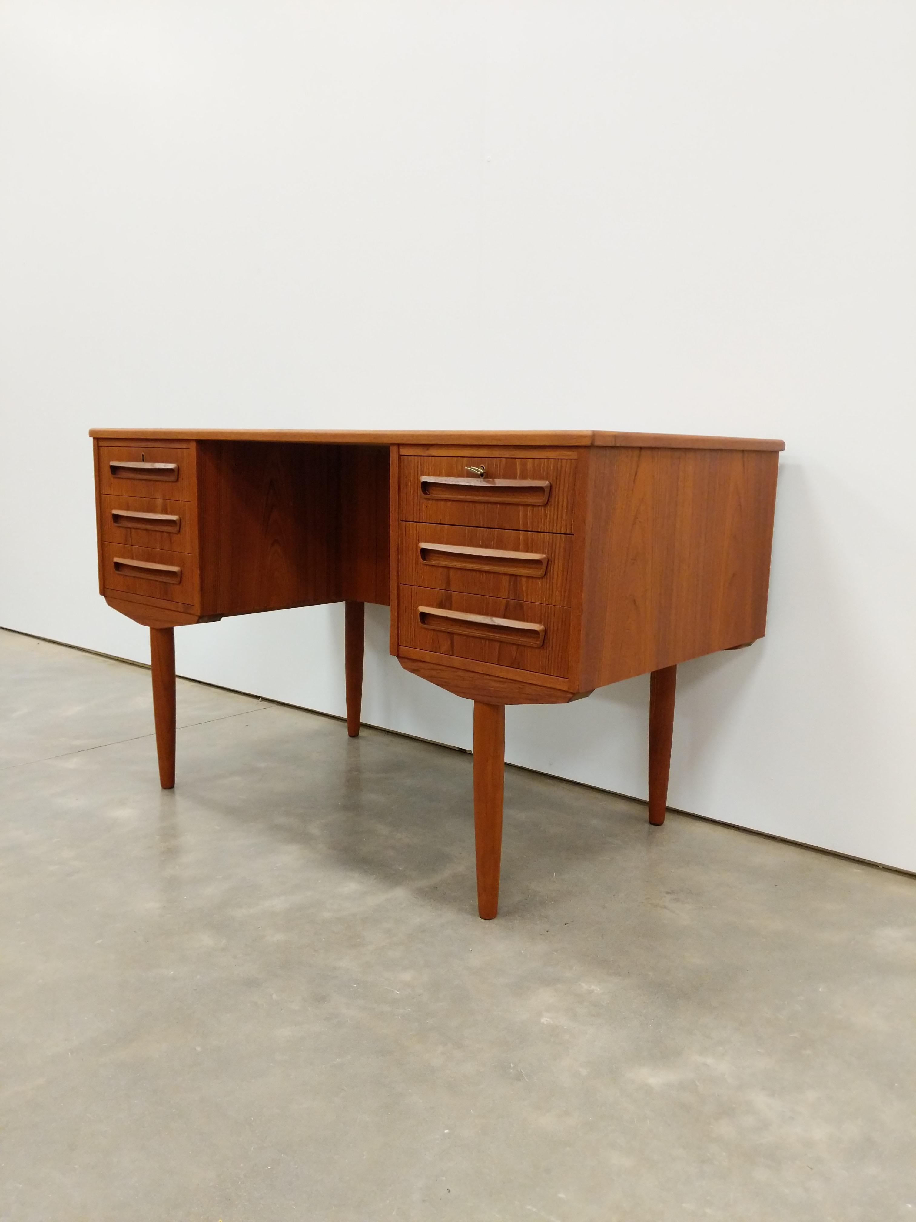 Authentic vintage mid century Danish / Scandinavian Modern teak desk.

Designed by J. Svenstrup for A.P. Møbler.

This piece is in excellent refinished condition with very few signs of age-related wear (see photos).

If you would like any additional