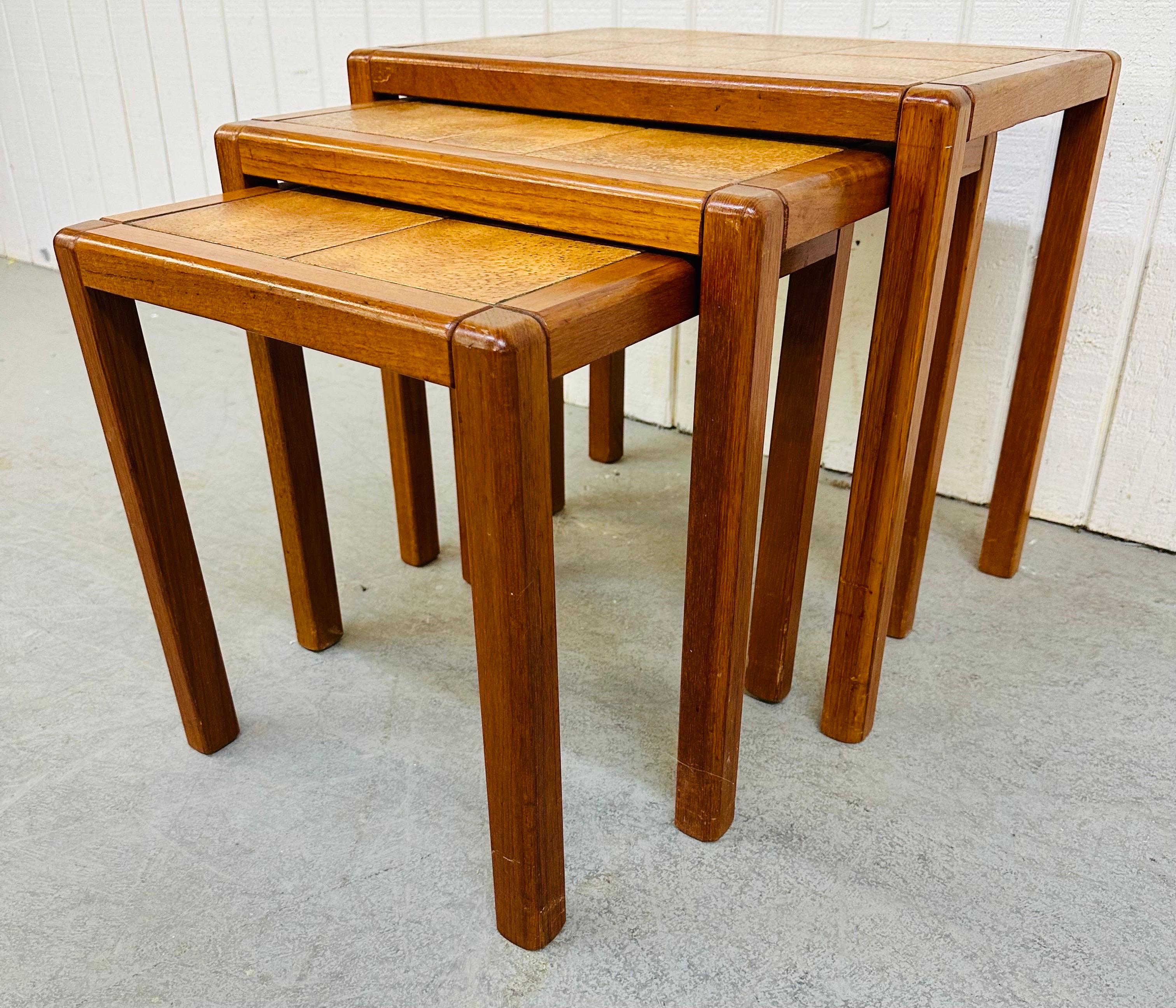 This listing is for a set of three vintage Danish Modern Teak Nesting Tables. Featuring a straight line design, rectangular tile tops, and a beautiful teak finish.
