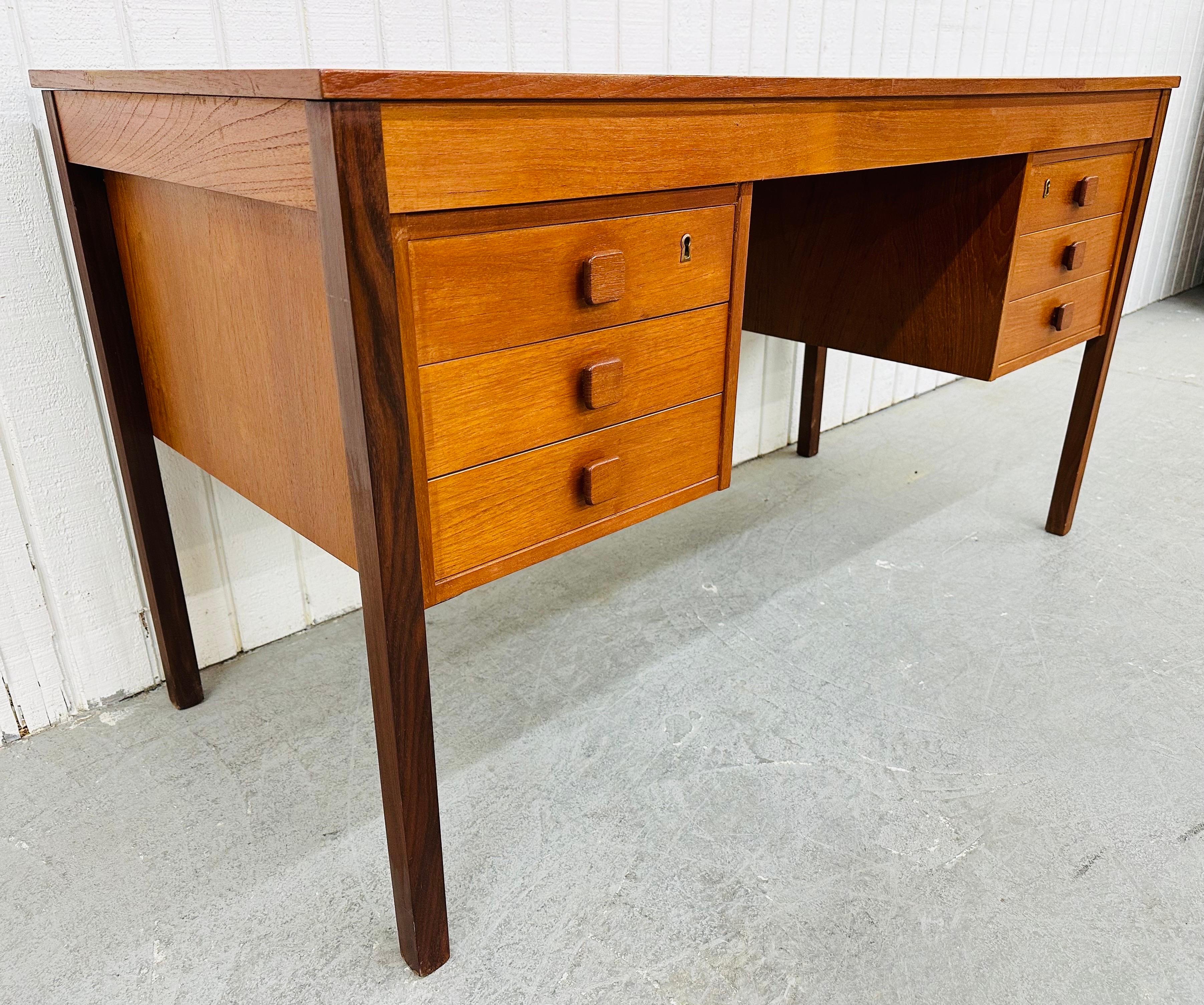 This listing is for a Vintage Danish Modern Teak Writing Desk. Featuring a straight line design, rectangular top, six drawers with wooden pulls for storage, modern legs, and a finished backside. This is an exceptional combination of quality and