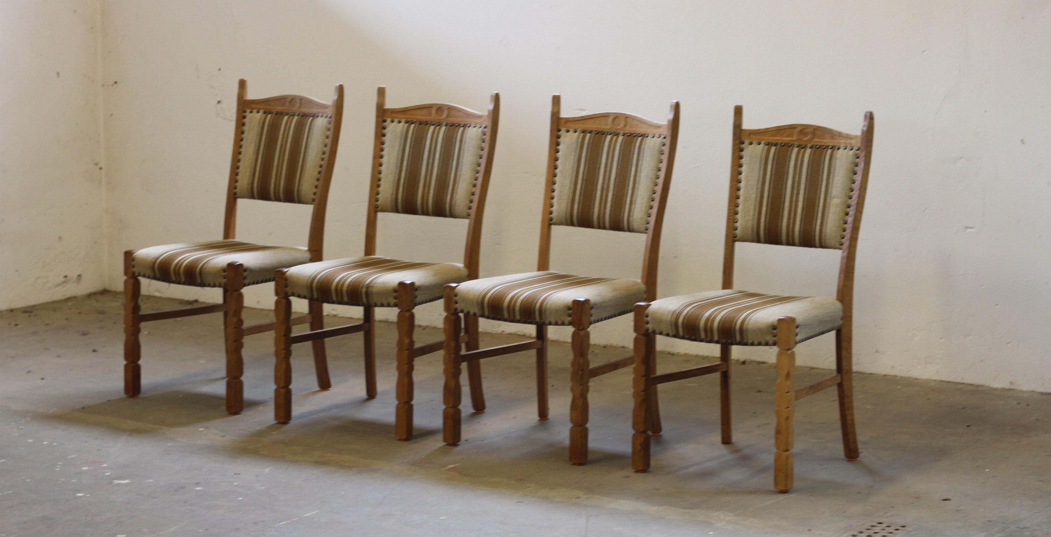 Crafted in Denmark in the 1960s/70s, inspired by Henning Kjærnulf’s Brutalist / Baroque Bold style. Each chair is solid with no damage to the wood, and the fabric is well-preserved and in good shape though we recomend a reupholstery in the near by