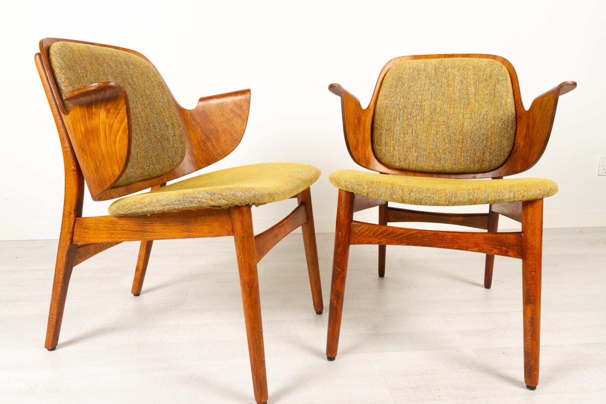 Vintage Danish pair of armchairs by Hans Olsen for Bramin 1950s
Pair of Danish Mid-Century Modern Model 107 lounge shell chairs in stained oak by Danish architect Hans Olsen. Back and armrest in one piece of shaped laminated wood. Seat and back