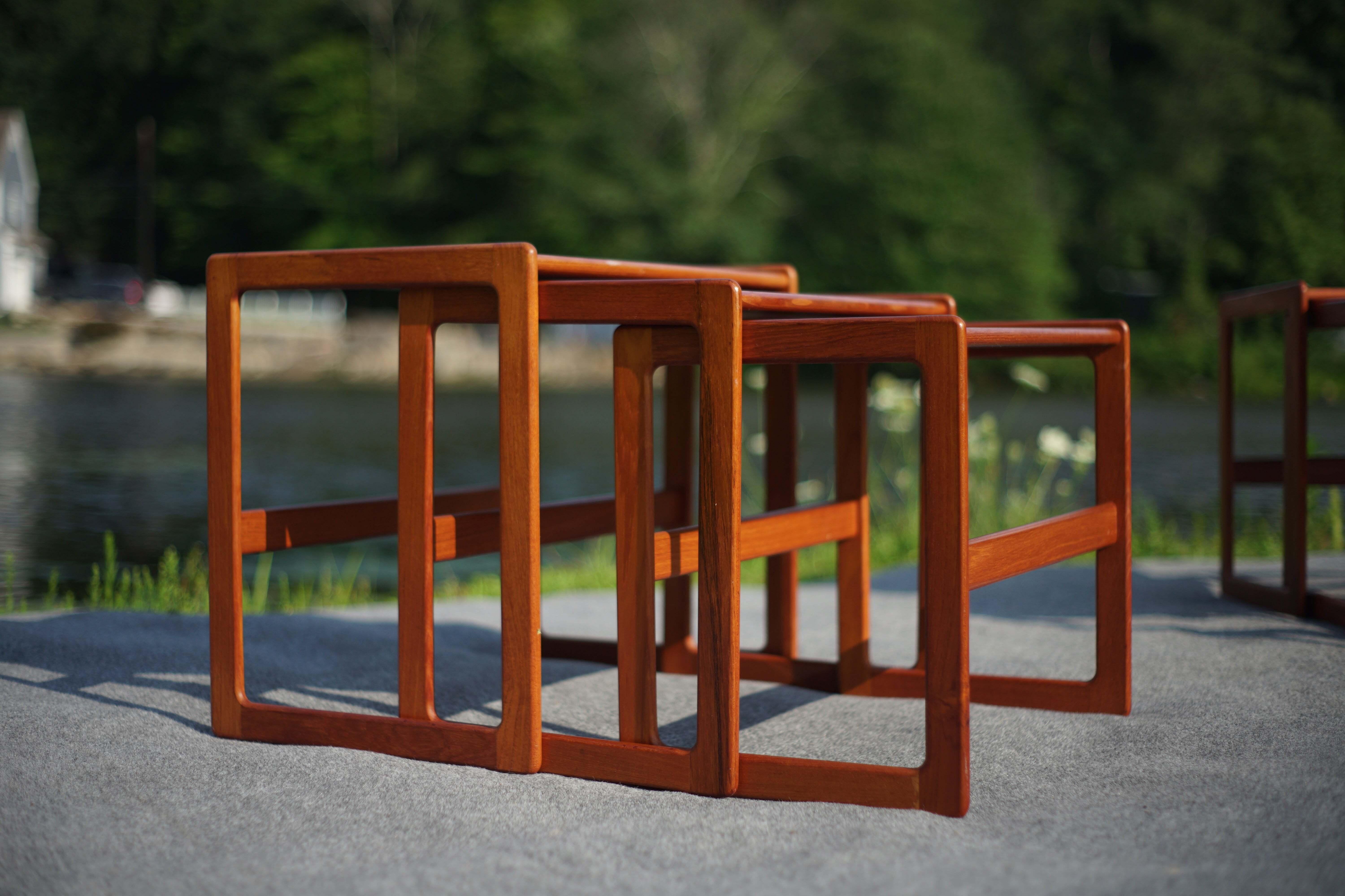 This lovely set of six nesting tables in teak are not only handsome, they are incredibly versatile. With curved corners, raised edges, and exquisite joinery, they offer several subtle, refined details as nesting tables or end tables. From an
