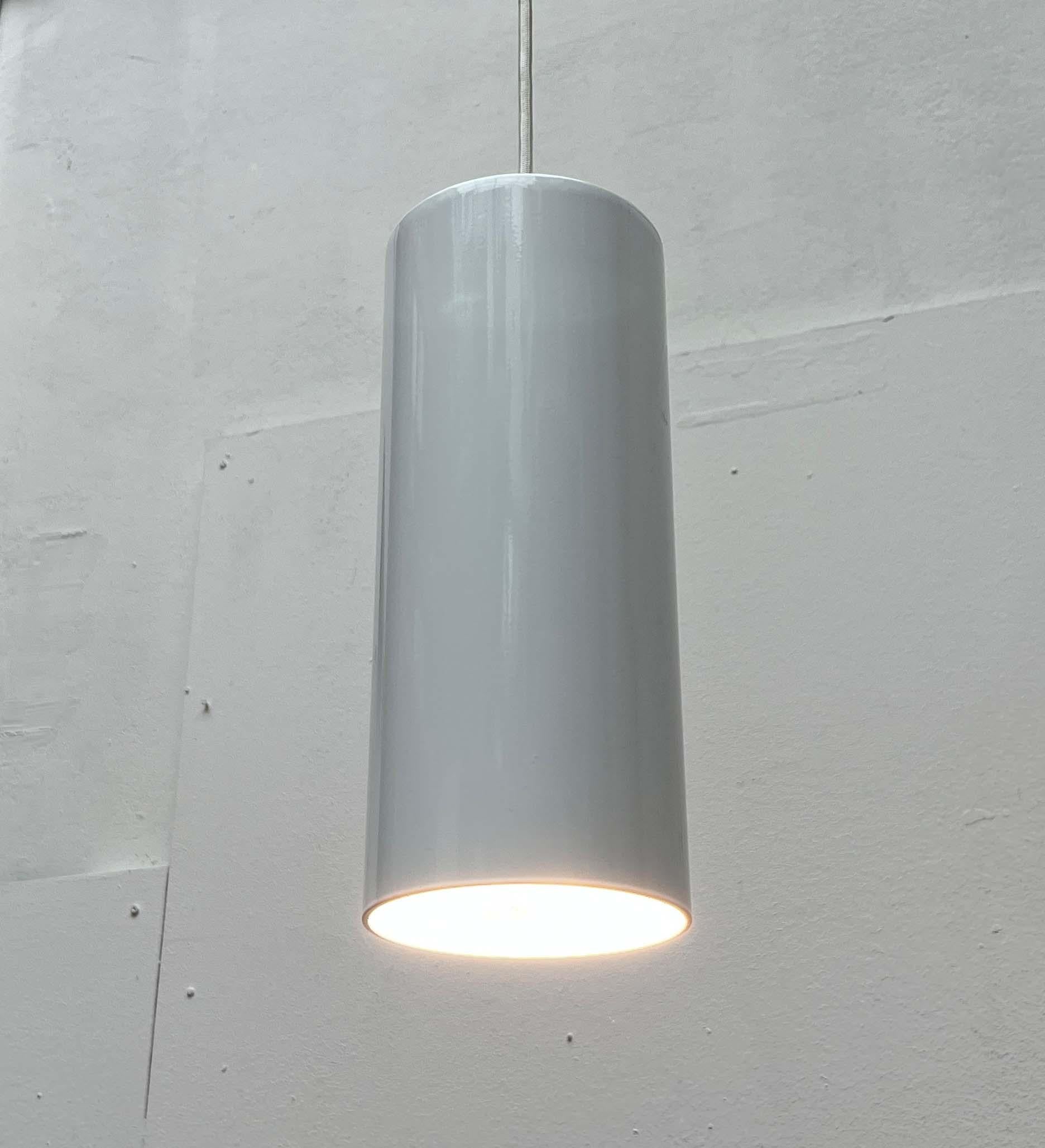 A simple pendant light from the danish manufacturer nordisk solar, based on a design by ole pless jørgensen from the 1970s.

a minimalist design. The white lamp body is of heavy quality and cylindrical in shape. The cylinder is open at the bottom.