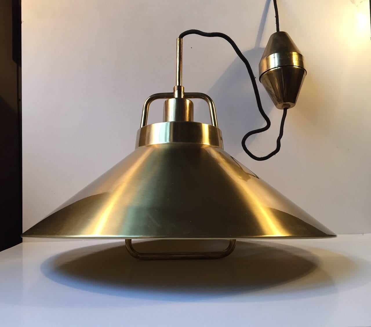 - Solid brass pendant light designed by Fritz Schlegel
- Manufactured by Lyfa in Denmark in the mid-1960s.
- Brass mounting bracket with adjustable height and original matching brass canopy
- Model P 295.