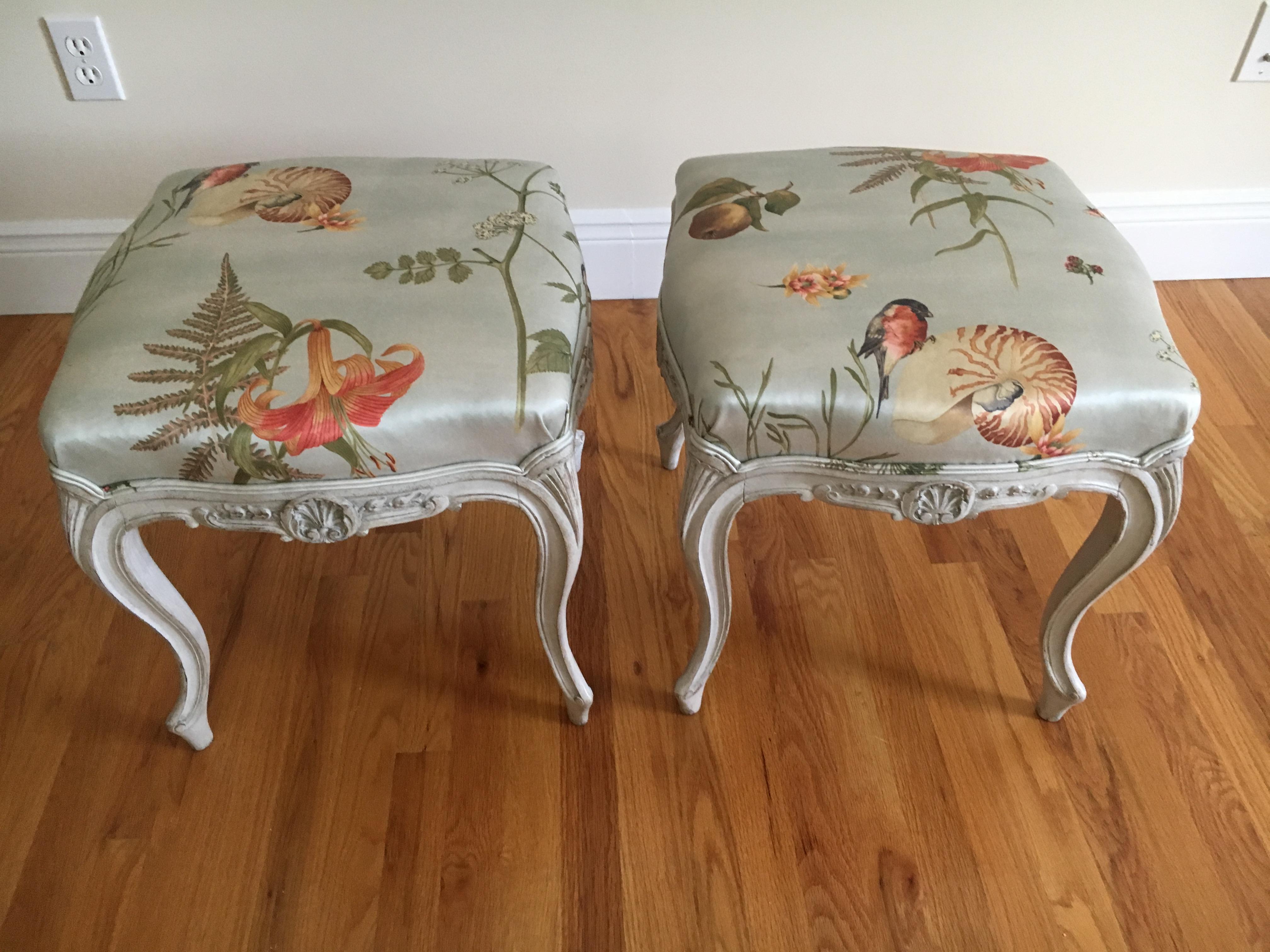 Beautiful pair of good sized Danish painted wood vintage Rococo style stools from the 1930s, carved and having a scallop motif. Newer upholstery in the delightfully whimsical bullfinch & nautilus silk or cotton blend by Scalamandre.