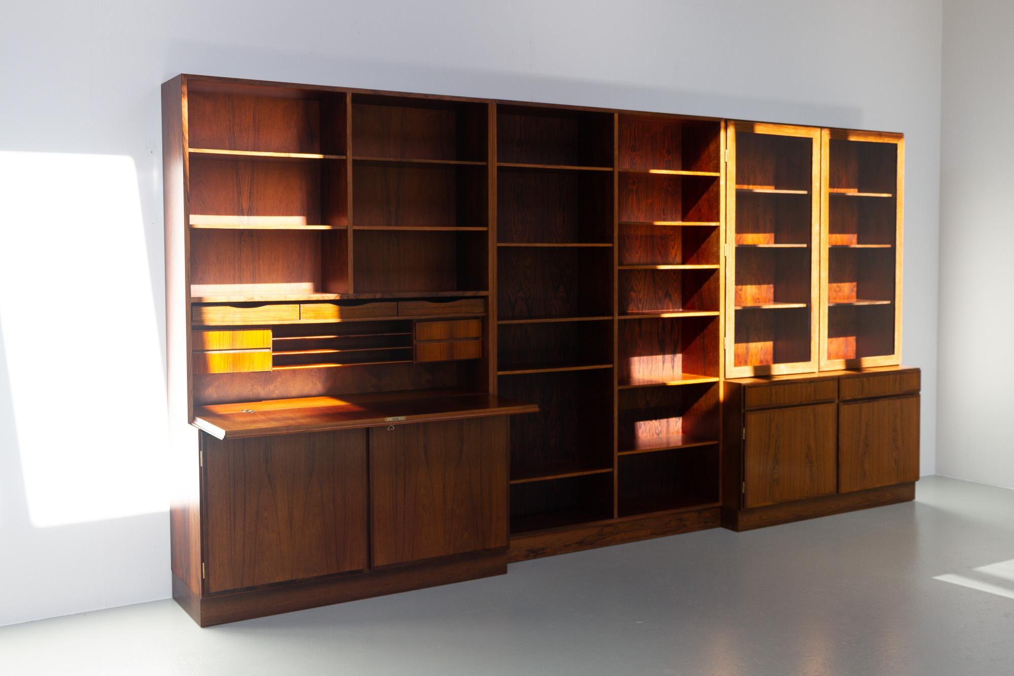 Vintage Danish Rosewood bookcase by Omann Jun, 1960s.
Large and impressive Scandinavian Modern three unit library by Omann Jun, Denmark, in stunning Rosewood veneer. This three part Danish library with plenty of storage space can be used as one