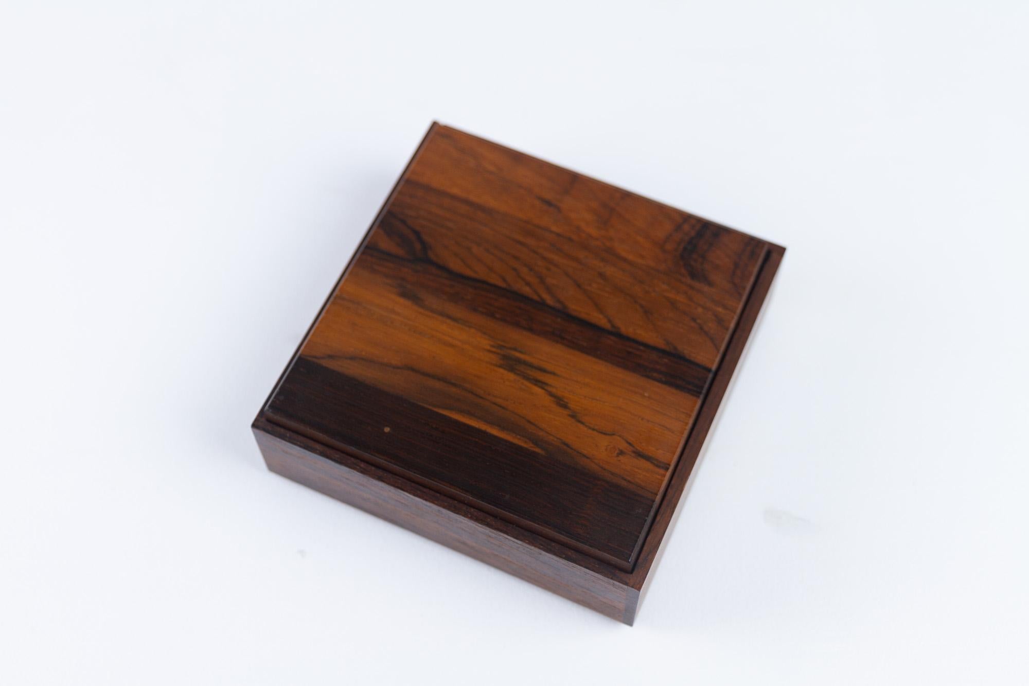 Vintage Danish Rosewood Box, 1960s.
Small decorative box with lid in solid rosewood and black Formica. Beautiful rosewood grain and color. 
Probably originally used for cigarettes or jewellery. 
Very good vintage condition. Minimal traces of use.