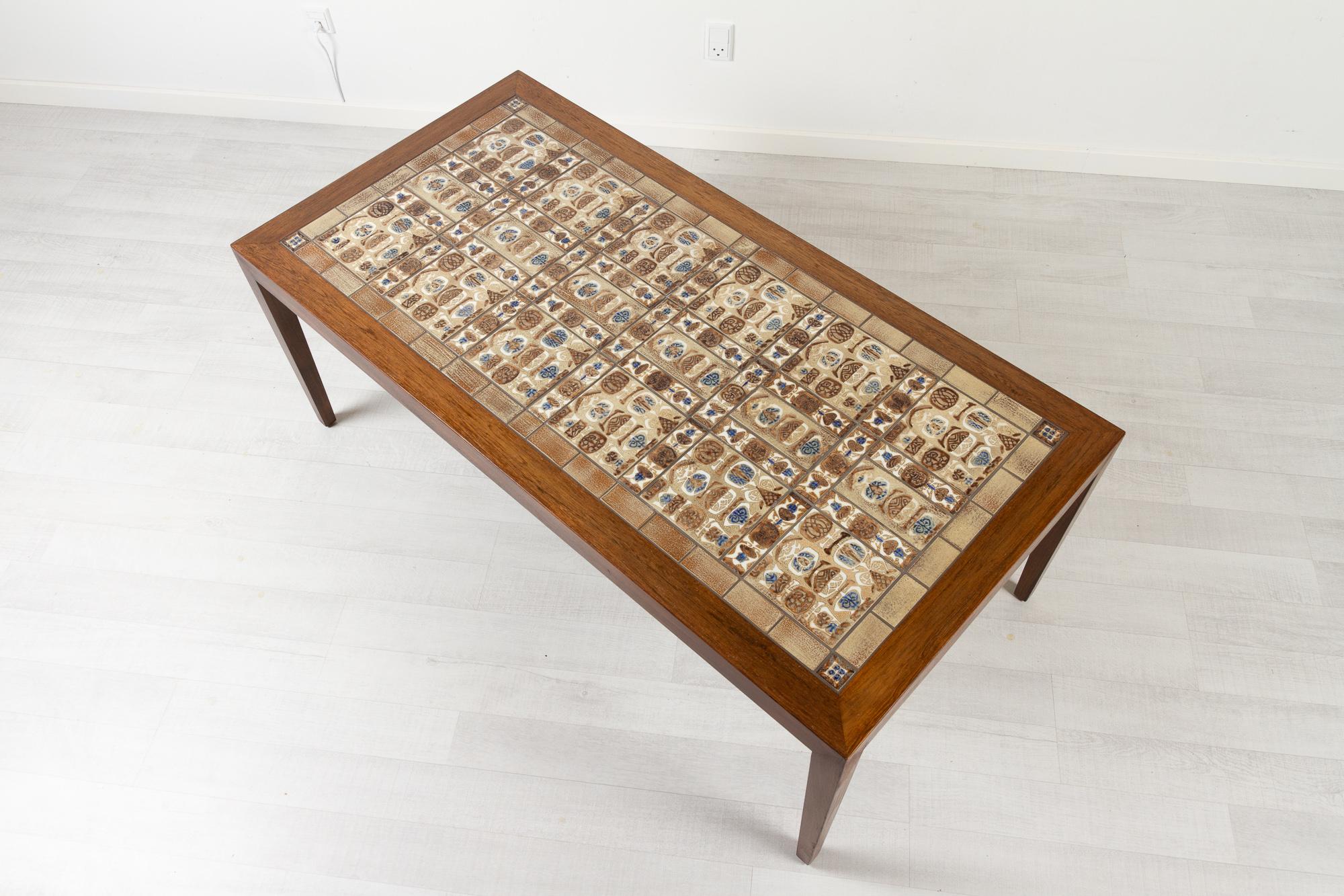 Vintage Danish rosewood coffee table by Severin Hansen for Haslev Møbelsnedkeri 1960s.
Danish Mid-Century Modern rectangular coffee table with inlaid Baca tiles from Royal Copenhagen. The tiles were designed by Danish artist Nils Thorsson who is