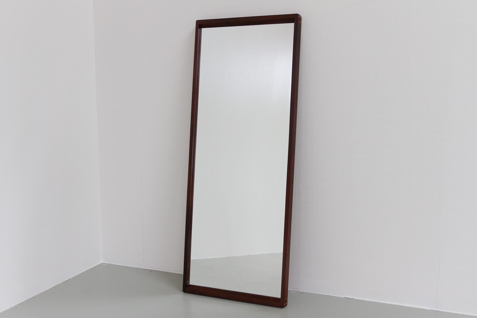 Vintage Danish rosewood wall mirror by Aksel Kjersgaard, 1960s.
Elegant Danish Modern tall wall mirror Model No. 145 designed by Danish architect Kai Kristiansen and manufactured by Aksel Kjersgaard, Odder, Denmark. Frame in solid rosewood with