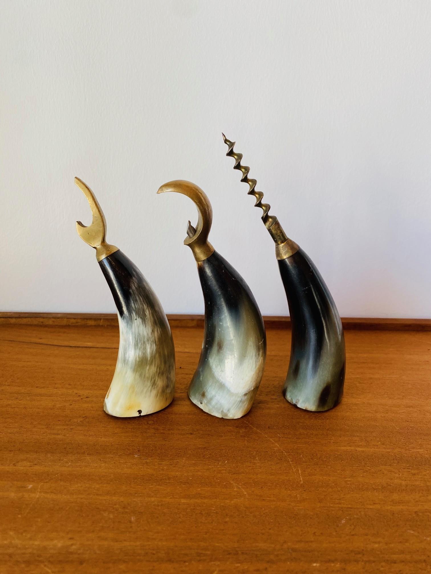 Beautiful set of 3 sculptural bottle openers from Denmark.  Stylish Viking style pieces that are sculptural and alluring.  Each piece is handmade and evokes wonder and chic.  Each combines organic elements with brass hardware that create a