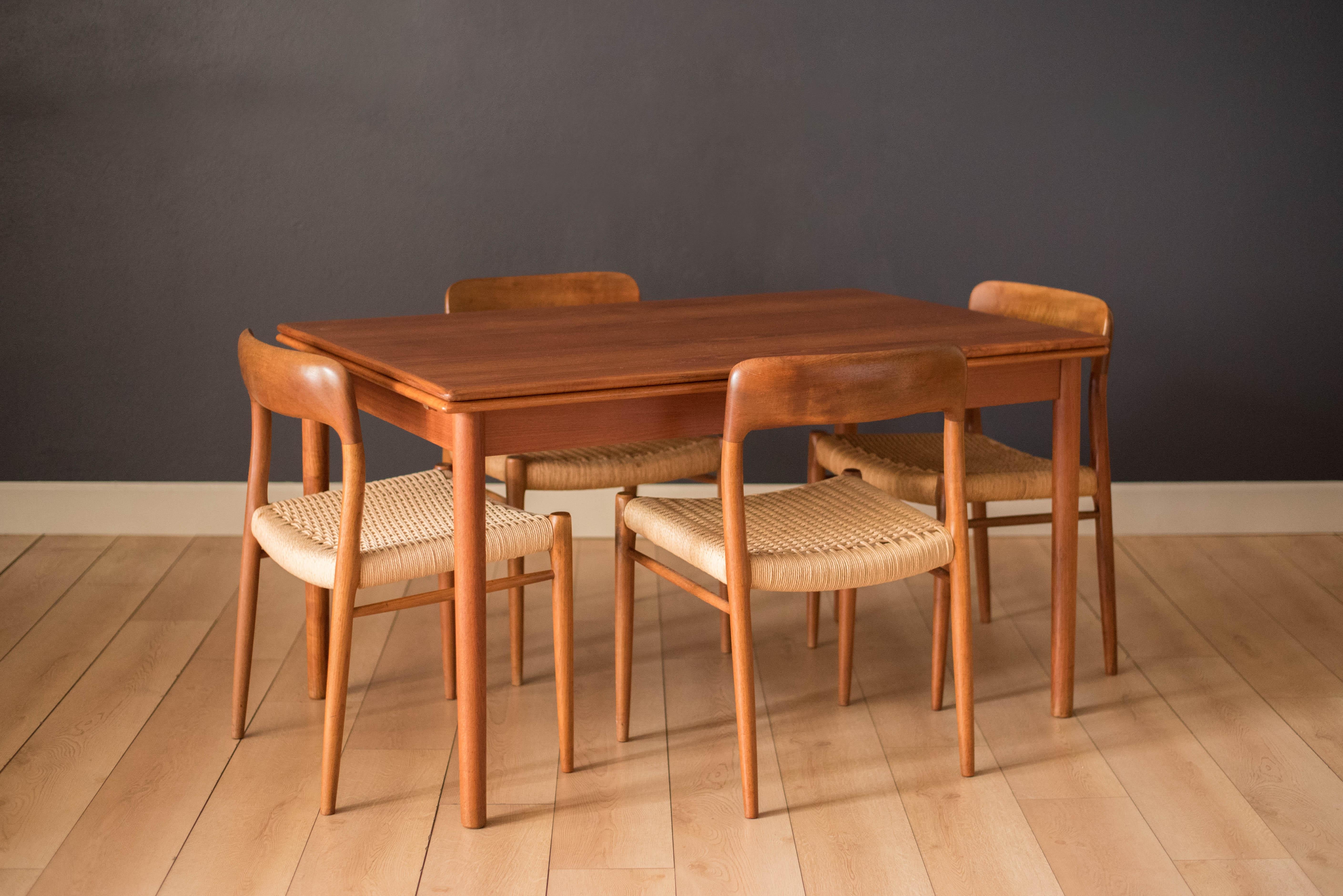 Mid Century Niels Møller dining chairs for J.L. Møller Møbelfabrik model #75 in teak. This set includes four chairs that have intact papercord seating. Teak dining table available in separate listing. 



Offered by Mid Century Maddist