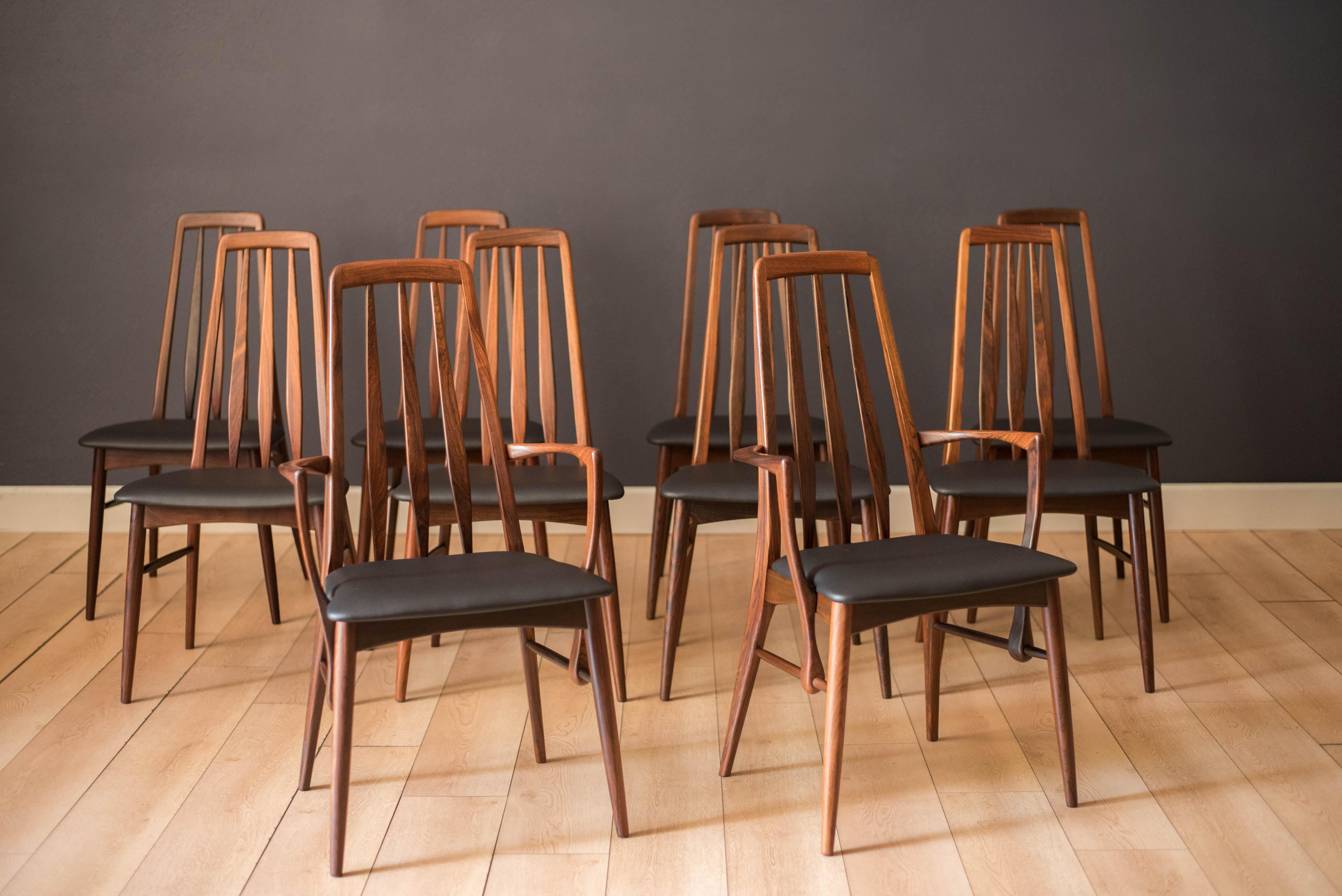 Mid Century Modern 'Eva' dining chairs by Niels Koefoed for Koefoeds Hornslet, circa 1960's. Features a sculptural rosewood frame designed with a tall backrest support. This set includes eight side chairs and two captain armchairs. The seats have