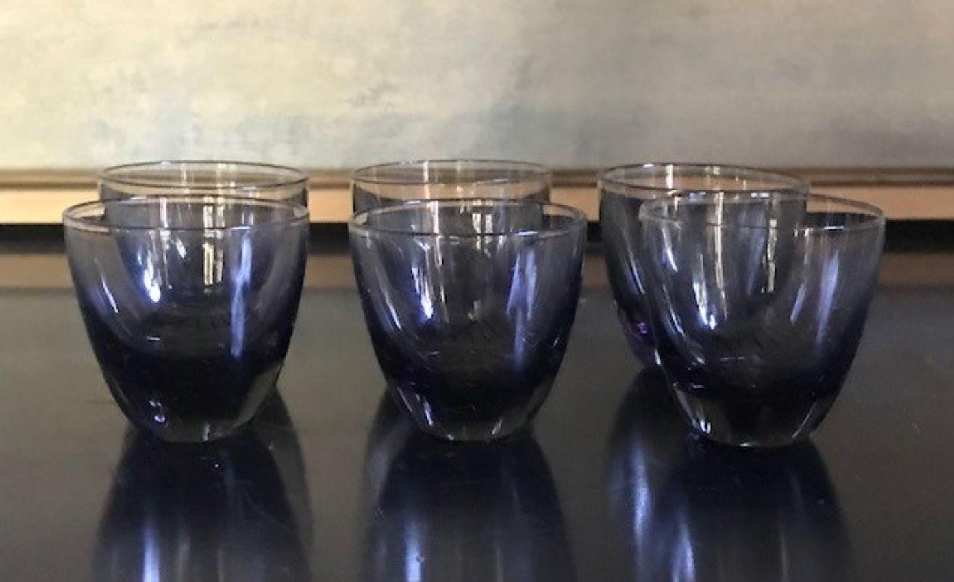 Set of six vintage handblown shot glasses attributed to the famous Danish glass maker Per Lutken. They are smoke glass and made for the Holmegaard glass factory.

They are 1.58 tall x 1.58 wide at the mouth