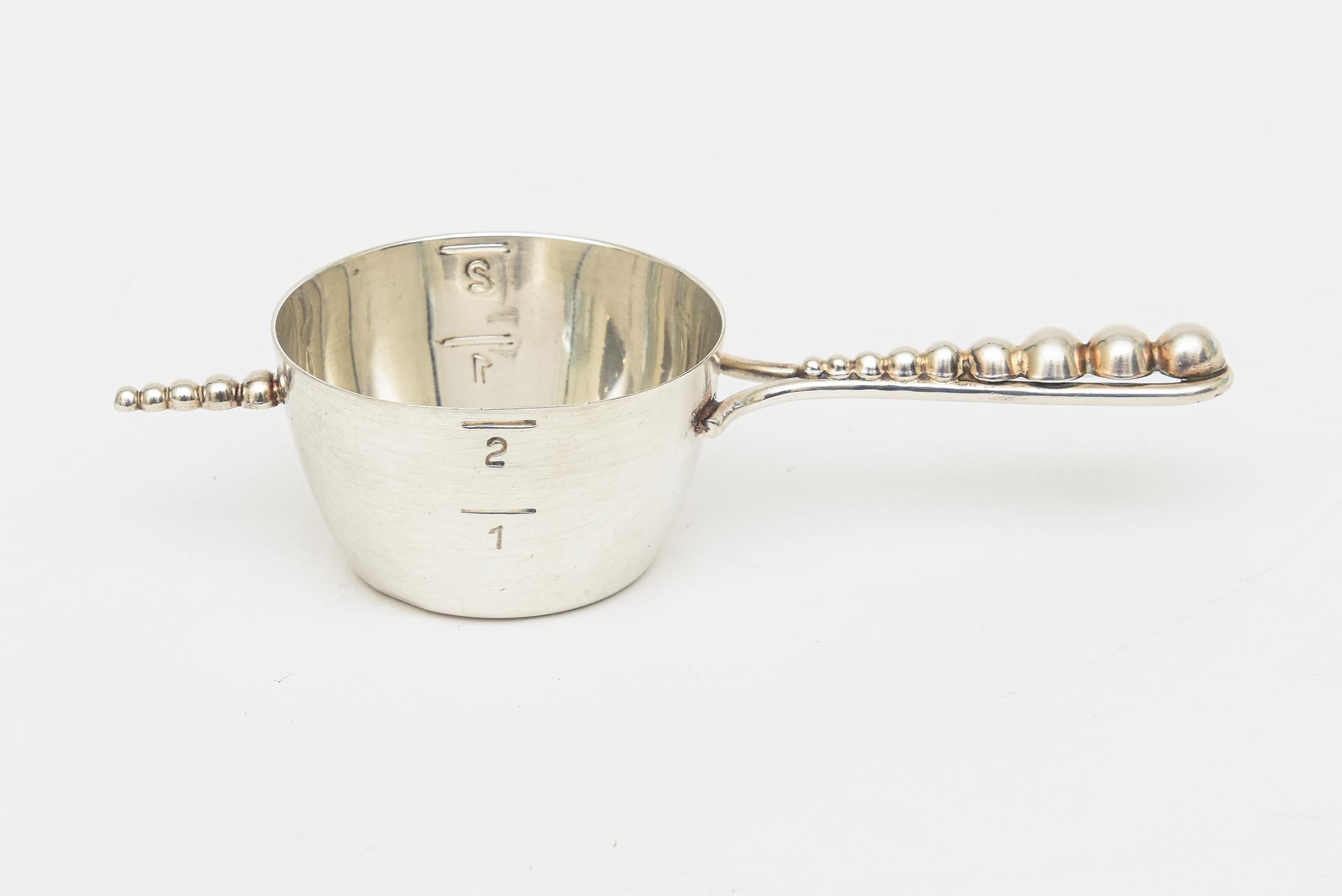 This vintage silver plate hallmarked bar jigger or measuring cup is from the 60's. It is from Denmark and has graduated ball forms on the front and handle. Hallmarked Denmark 611 with a crown like form.  Very Modern. Great barware. PLEASE NOTE: THIS