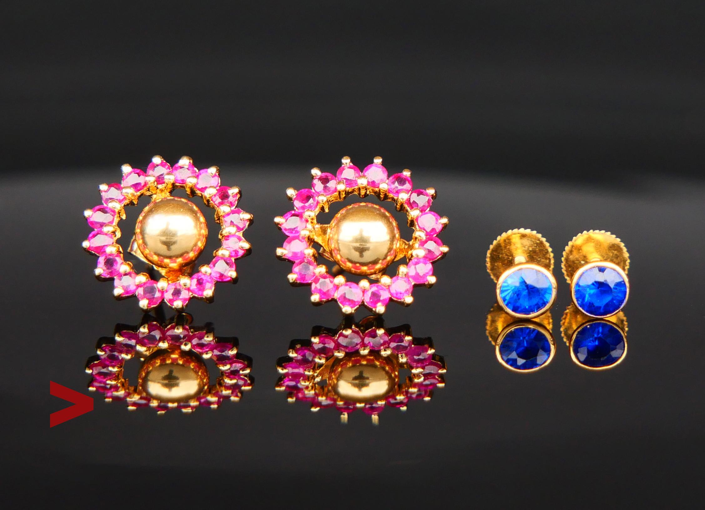 A pair of vintage Danish hand-made halo studs from the 1970s in solid 18K Yellow Gold, each decorated with 16 diamond cut Rubies and removable central studs with bezel set blue sapphires that can be switched for ball-shaped studs or any other studs
