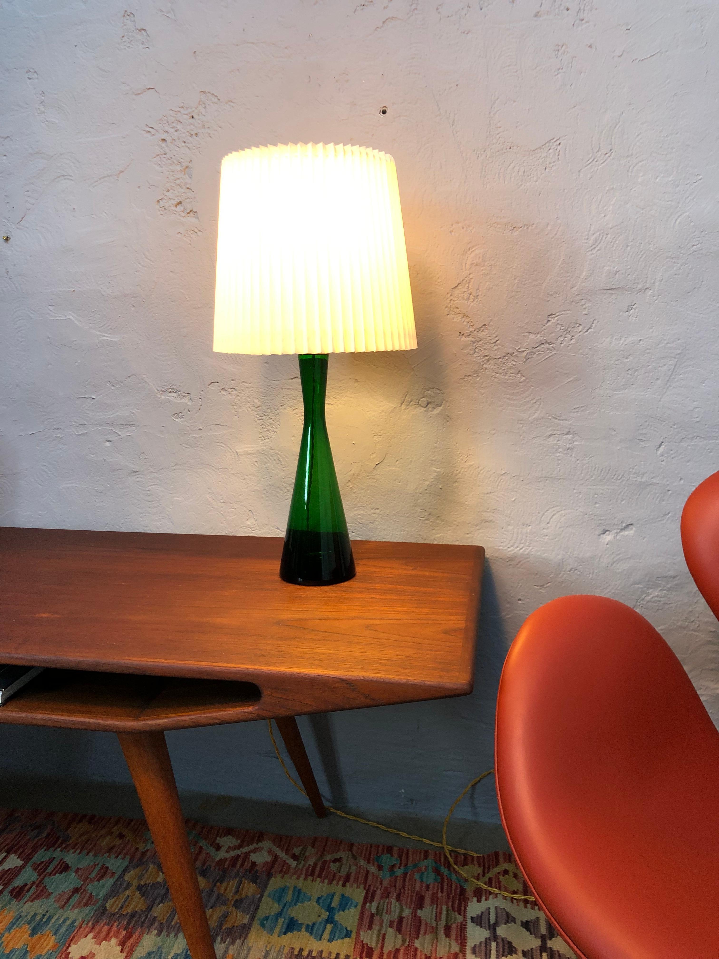 Vintage Danish table lamp by Kastrup Glass for Holmegaard in green hand blown glass from the 1960s.
Rewired with twisted gold cloth flex and can be delivered with an EU UK or US plug.
Shade can be purchased. 

The work was laid on 12 October 1847 by