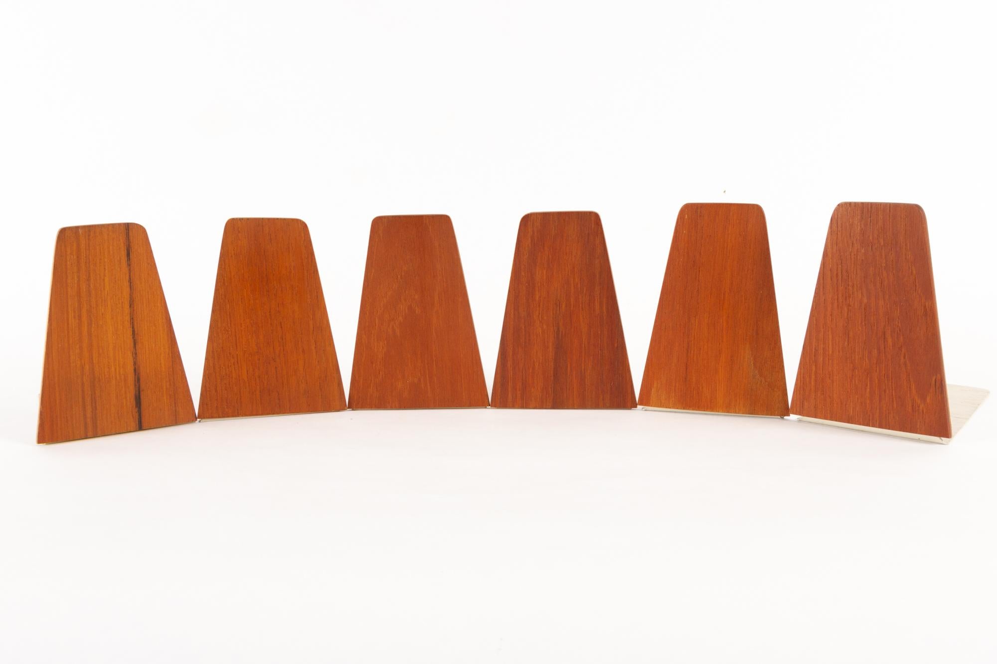 Vintage Danish teak bookends by Kai Kristiansen for FM 1960s set of 6.
These book ends can be used in any bookcase but were originally designed as a part of the FM Reolen wall unit by Danish architect Kai Kristiansen.
Very good original condition.
