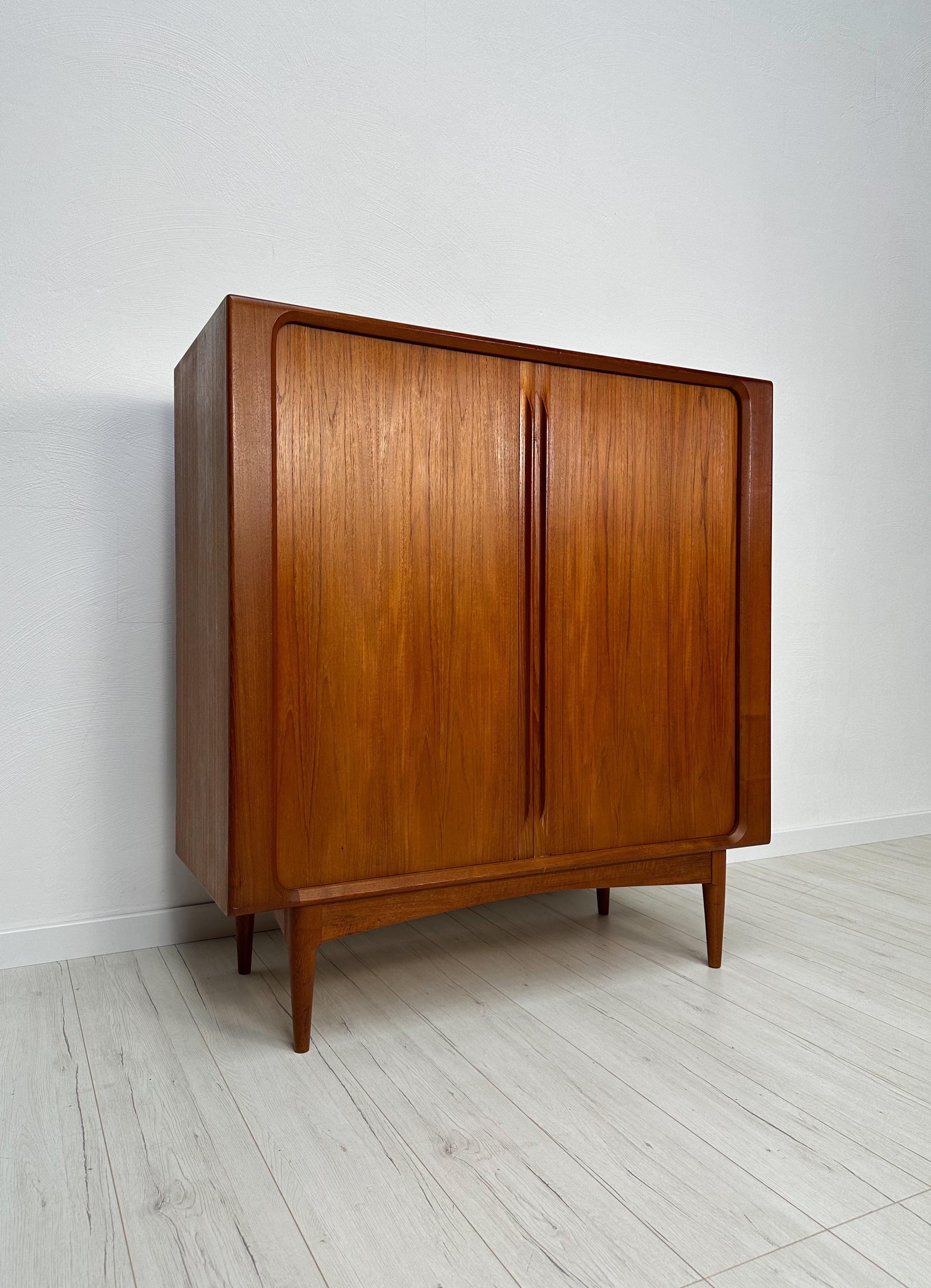 Vintage high quality teak highboard from Denmark by Bernhard Pedersen & Søn, 1960s. Elegant tambour doors with organically shaped door handles. Very neat original vintage condition with age-related signs of use. 

Dimensions: W 120 x H 128 x D 48cm