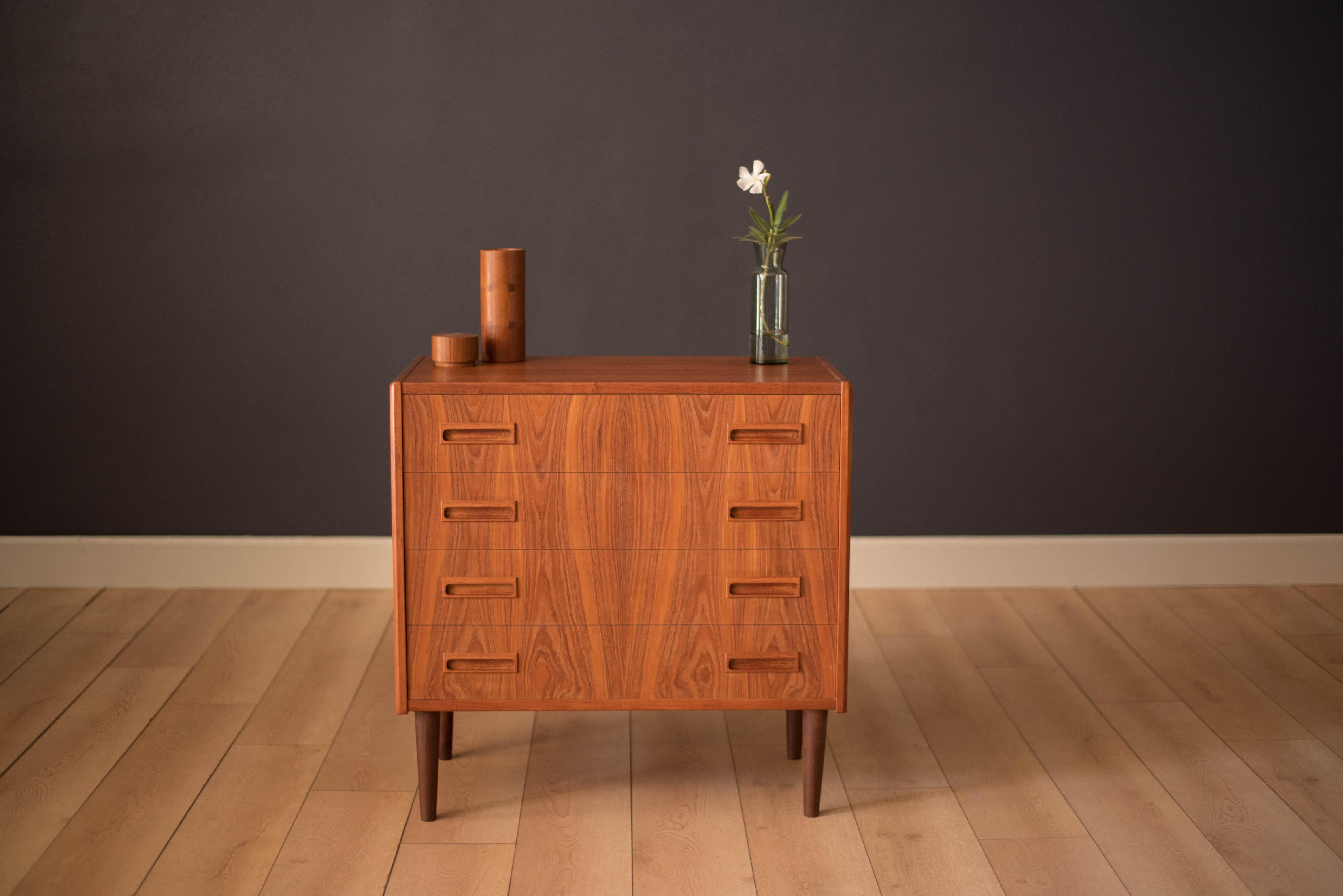 Mid-Century Modern dresser chest by Børge Seindal for P. Westergaards Møbelfabrik in teak. This piece includes four dovetailed drawers with unique sculpted handles. Features a flowing teak grain facade and Classic dowel legs. A functional small