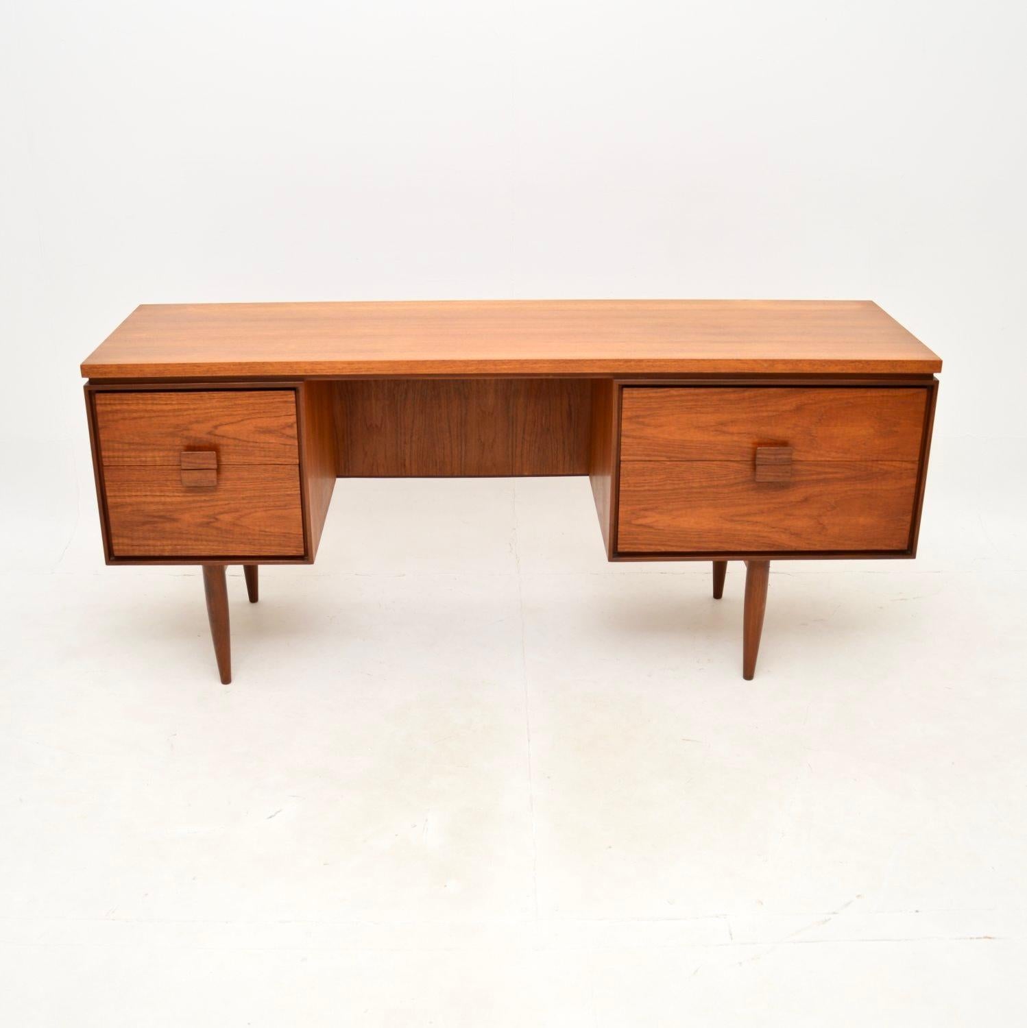 A very stylish and extremely well made vintage Danish teak desk by Kofod Larsen for G Plan. This was designed by the famous Danish designer IB Kofod Larsen for the G Plan Danish range, it was made in England in the 1960’s.

The quality is superb,