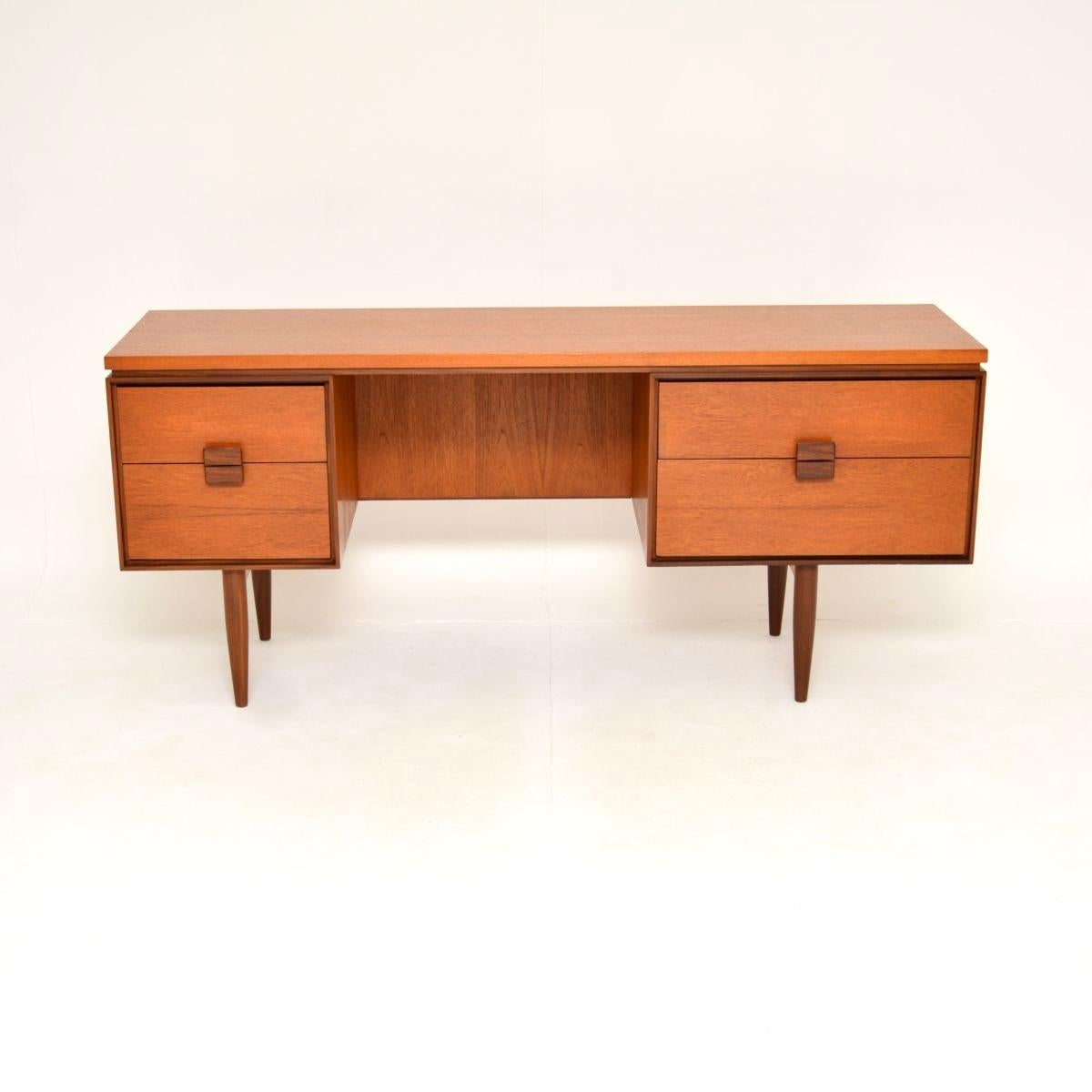 A very stylish and extremely well made vintage Danish teak desk by Kofod Larsen for G Plan. This was designed by the famous Danish designer IB Kofod Larsen for the G Plan Danish range, it was made in England in the 1960’s.

The quality is superb,