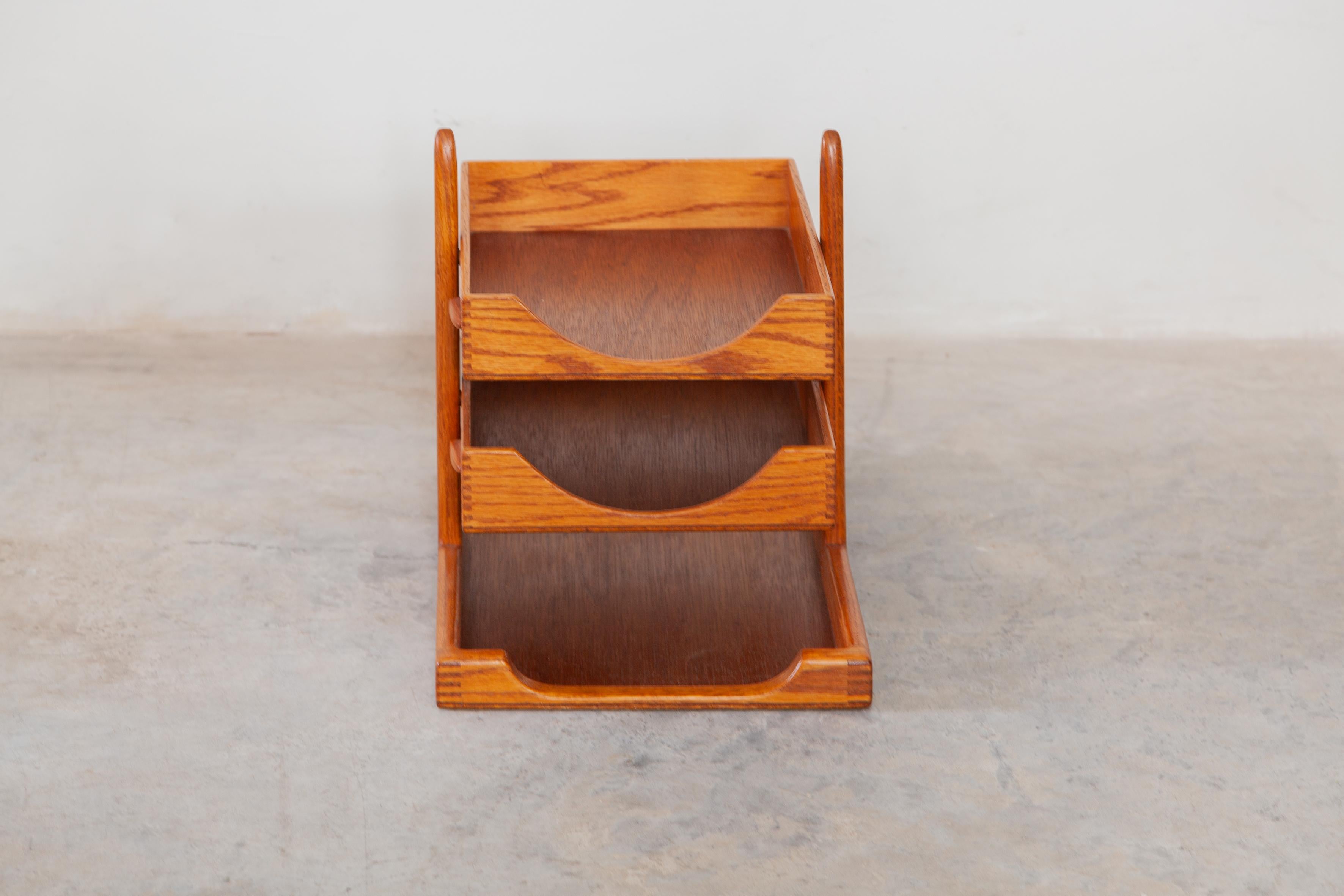 Danish modern functional accessory teak desk organizer or letter tray. There are three letter trays in the holder .The piece has a very light colored finish and is in good vintage condition.