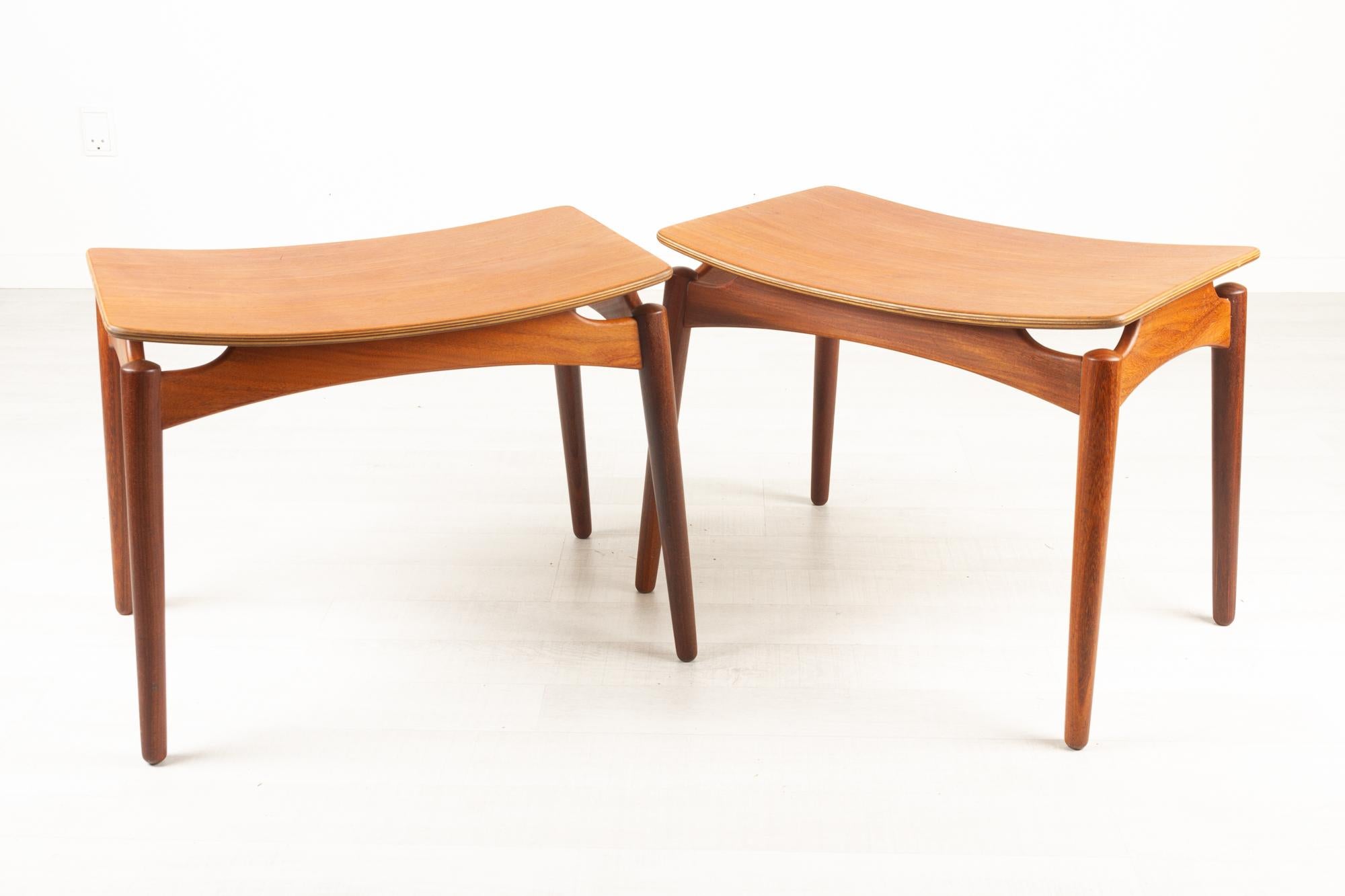 Vintage Danish teak footstools by sigfred Omann for Ølholm Møbelfabrik 1950s Set of 2.
Pair of identical Danish Mid-Century Modern foot rests. Very elegant design with curved frame and floating seat. Round tapered legs and frame in solid teak, top