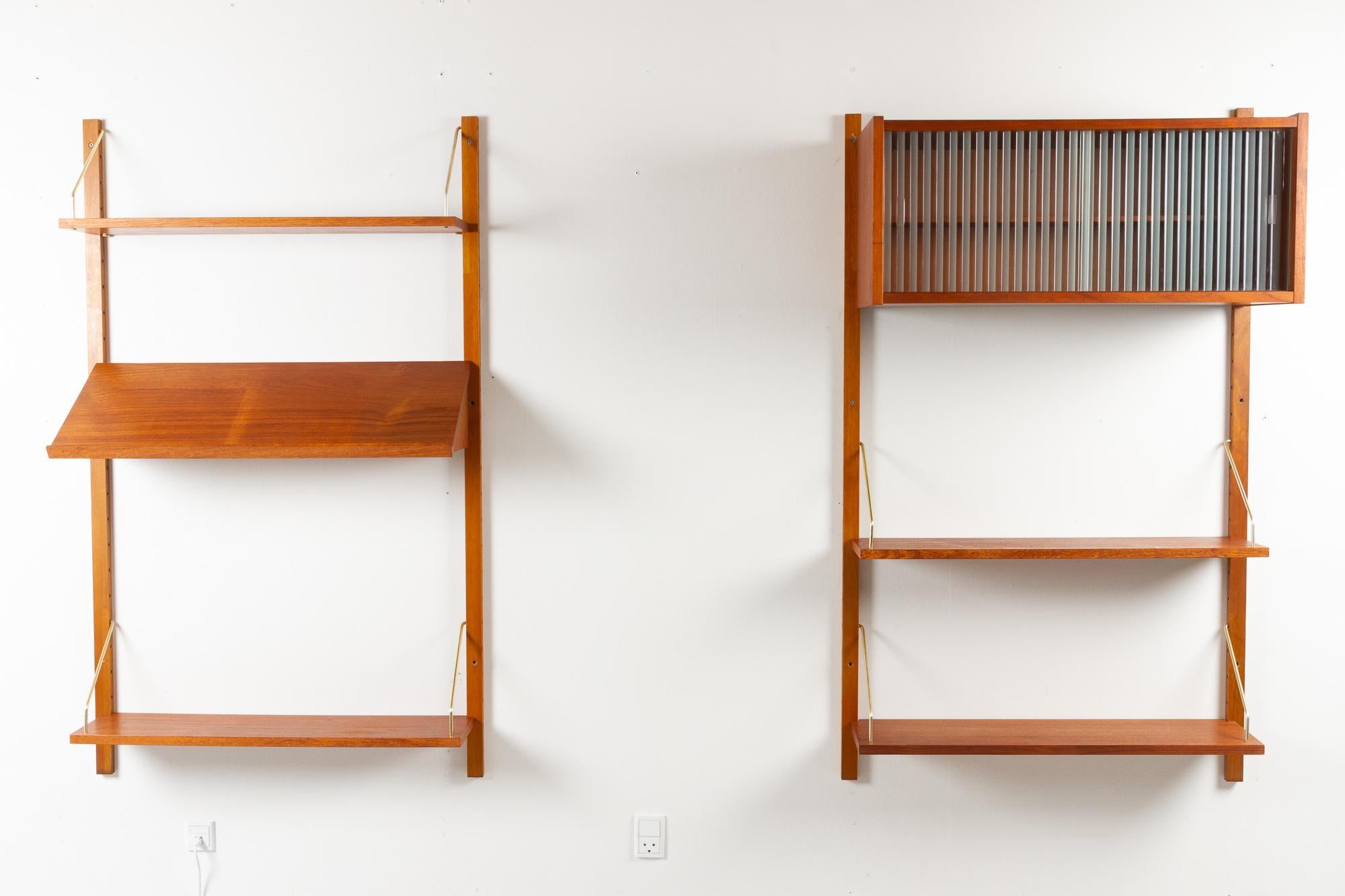 Vintage Danish teak modular wall unit 1960s
Danish Mid-century modern shelving system in teak with golden brackets. Cabinet and shelves can be placed as desired. This set can be used as one two bay system or as two individual units.

This set