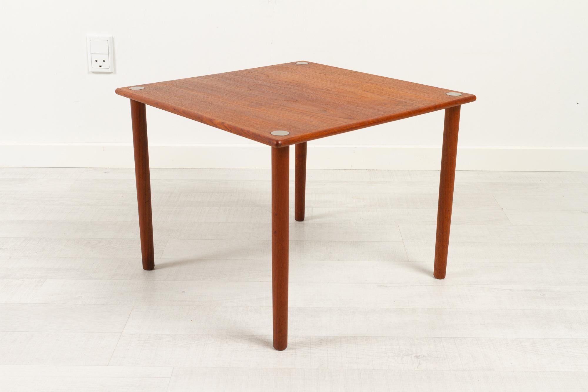 Vintage Danish Teak Side table by Georg Petersen, 1960s.
Danish mid-century modern occasional table in teak and aluminium. Made by by Georg Petersens Møbelfabrik, Denmark, in the 1960s.
Charming and versatile teak table with aluminium details on the