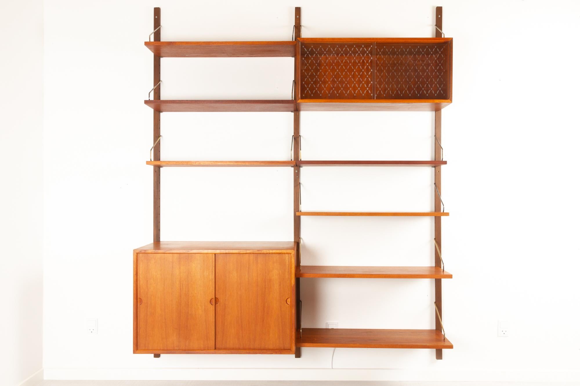 Vintage Danish teak wall unit by Poul Cadovius for Cado, 1950s.
Mid-Century Modern 2 bay shelving system model Royal. This is a original vintage shelving system designed in 1948 by Danish architect Poul Cadovius. 
Cadovius had the revolutionary