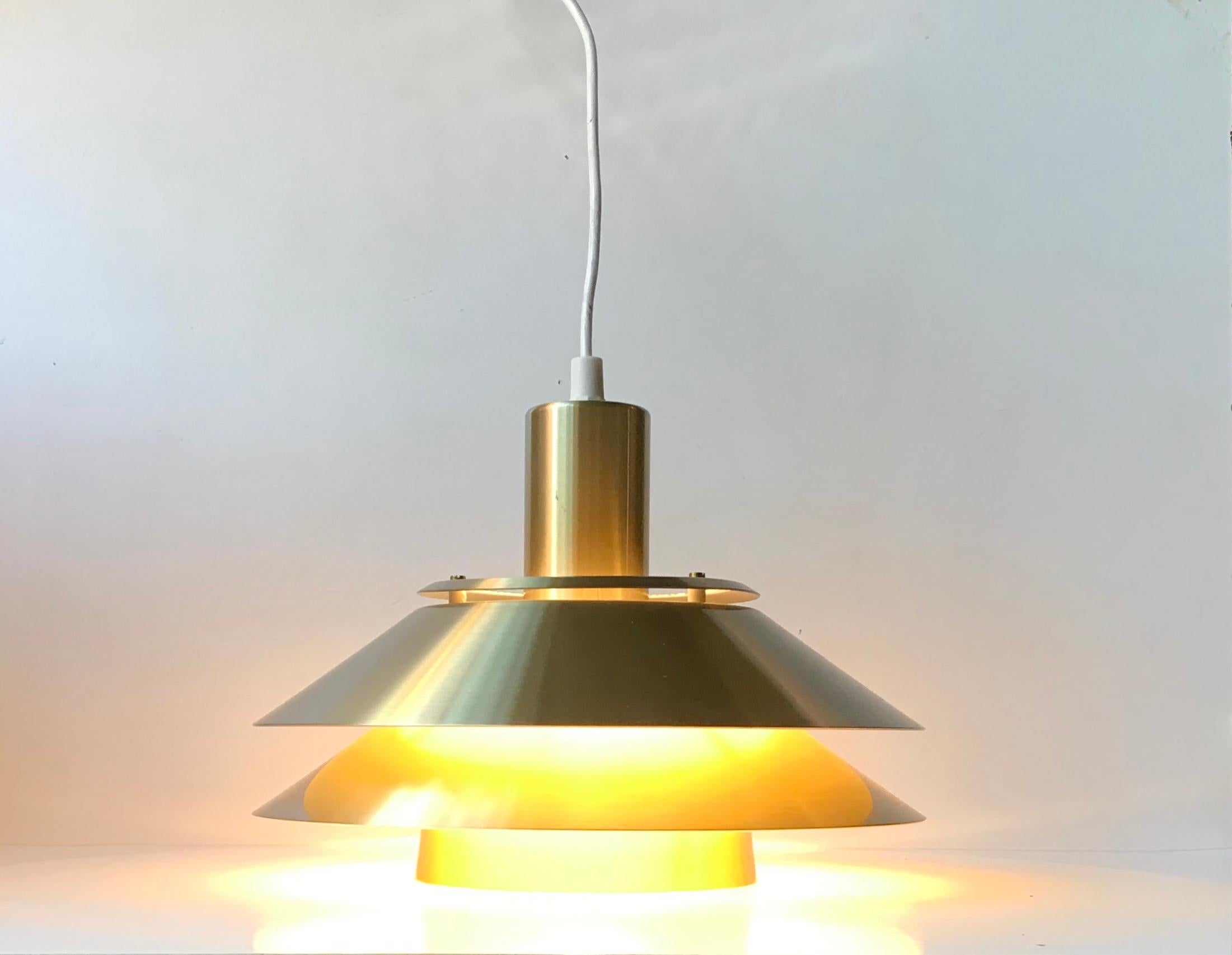 - Tiered hanging ceiling light
 - Designed and manufactured by Jeka Belysning in Denmark during the 1970s
 - Reminiscent of the PH 4 and PH 5 lamps by Poul Henningsen
 - It is constructed of brass-anodized/coated aluminium
 - Reflective white