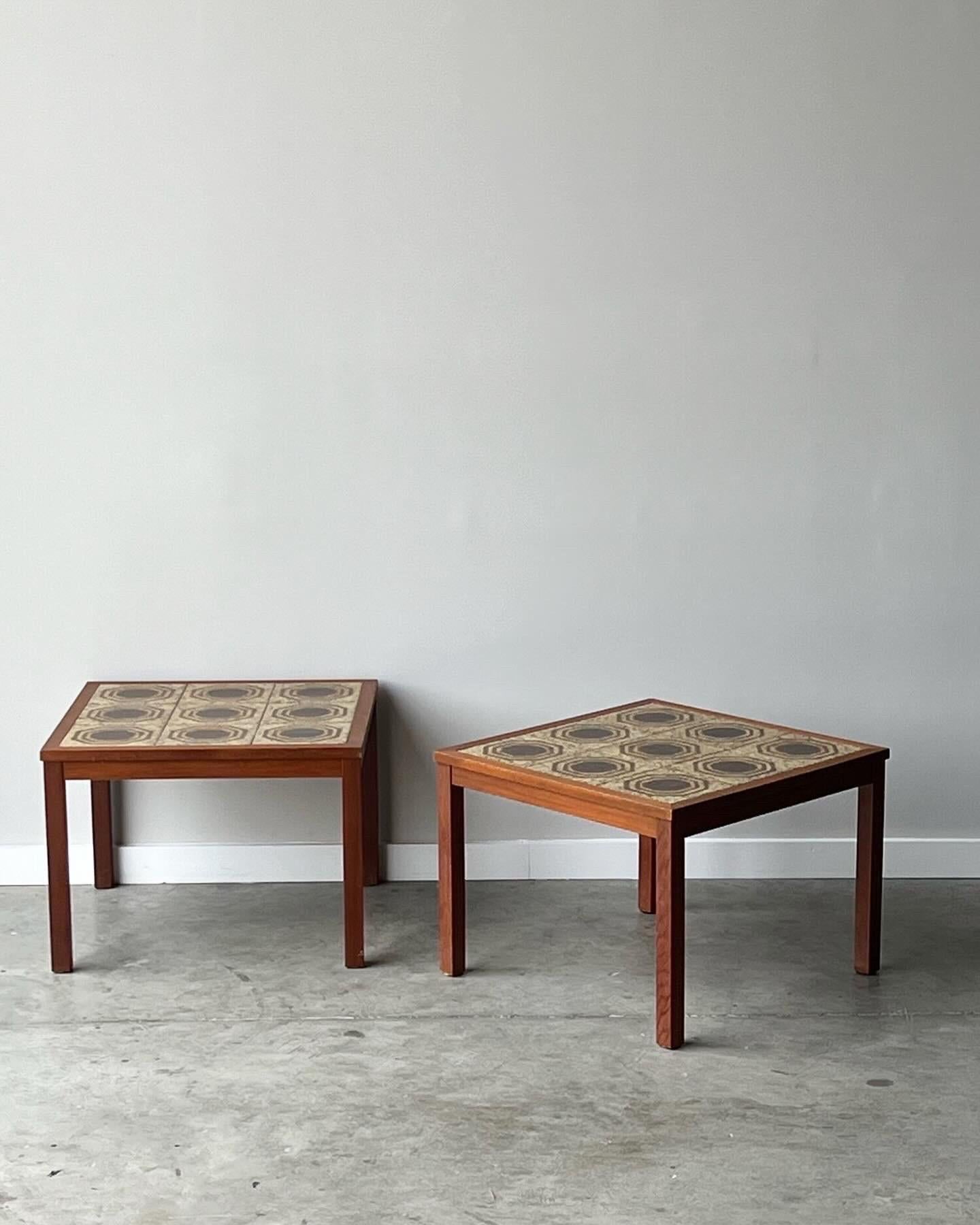 These gorgeous vintage end tables are so cool and perfect for plants or any items table side. Hearty teak wood frames with very cool glazed and well designed tiles. In good vintage condition with minor wear consistent with age and use. One small