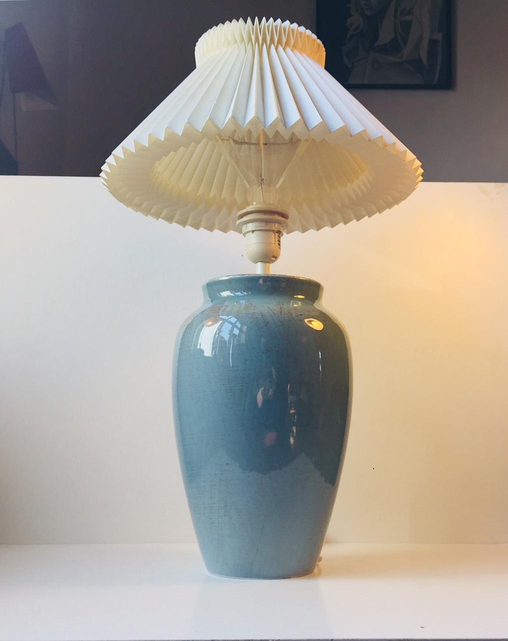 Large Turquoise pottery table light from the Danish lighting company Vitrika & Junge. This company only existed for a few years. The ceramic corpus was most likely manufactured at Palshus for Vitrika during the 1970s. The shade is not included.