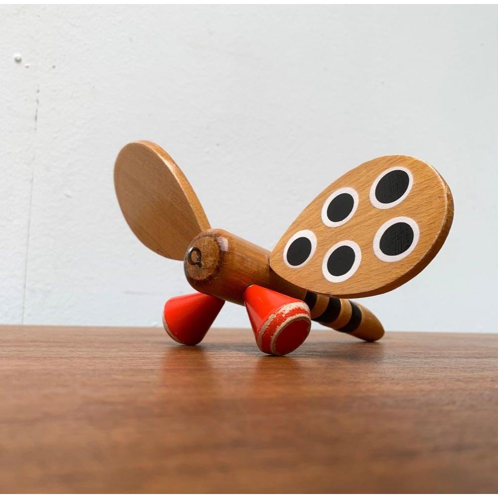 Vintage Danish Wooden Dragonfly Toy, 1970s, in Very Good conditions. Designed 1970 to 1979

Additional information:
Materials: Metal, Wood
Color: Beige
Item Type: Vintage, Antique or Pre-owned
Dimensions: 7.87ʺW × 7.87ʺD × 3.94ʺH
Condition: Unknown,