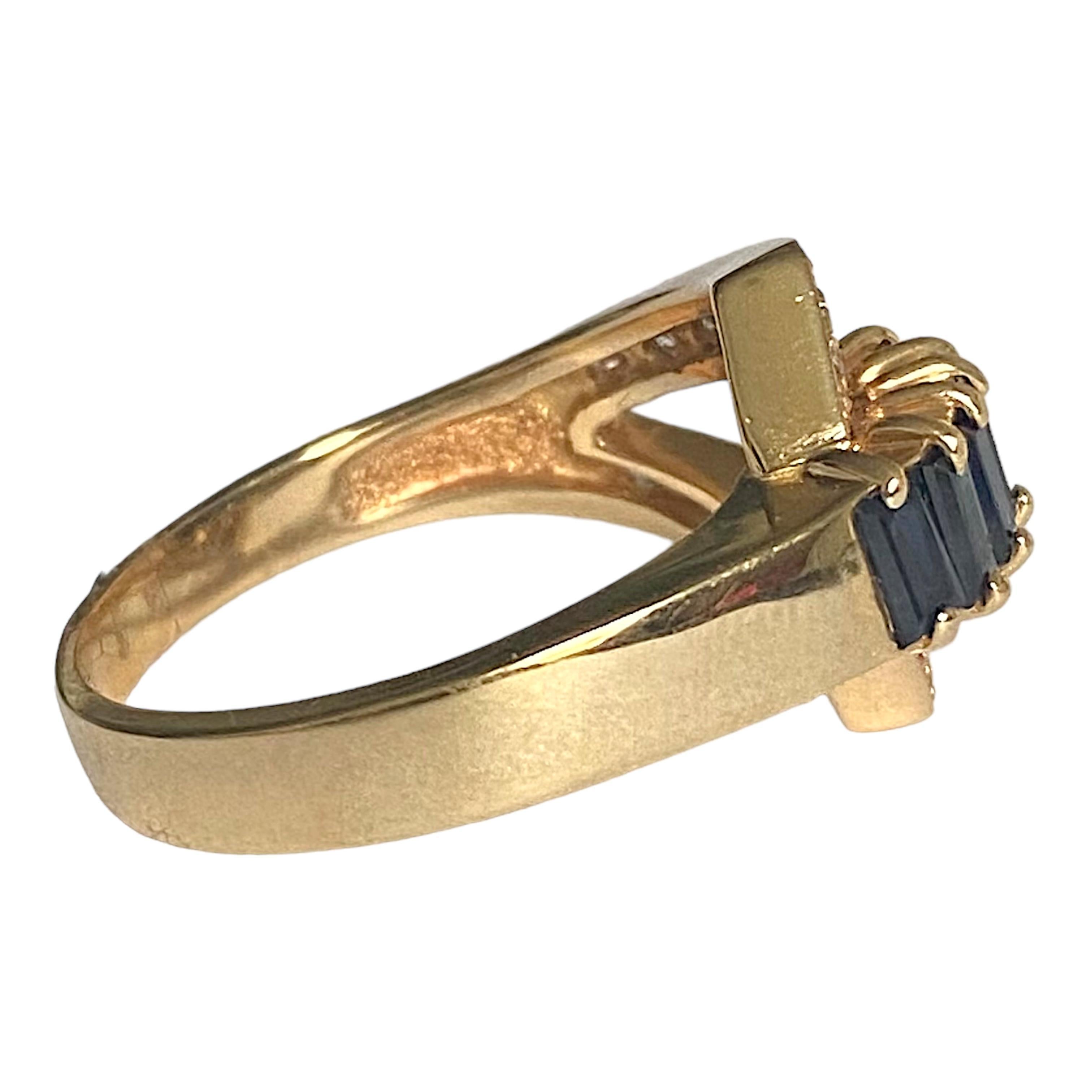 Vintage Dankner 14K yellow gold sapphire and diamond buckle ring.
7 baguette cut sapphires: 1.50ctw.
14 round brilliant cut diamonds: 0.45ctw. Color: F-G, Clarity: VS1-VS2
Measurements:
Width: 13.5 mm (front) - 3 mm (band)
Weight: 6.1 grams
Size: 8
