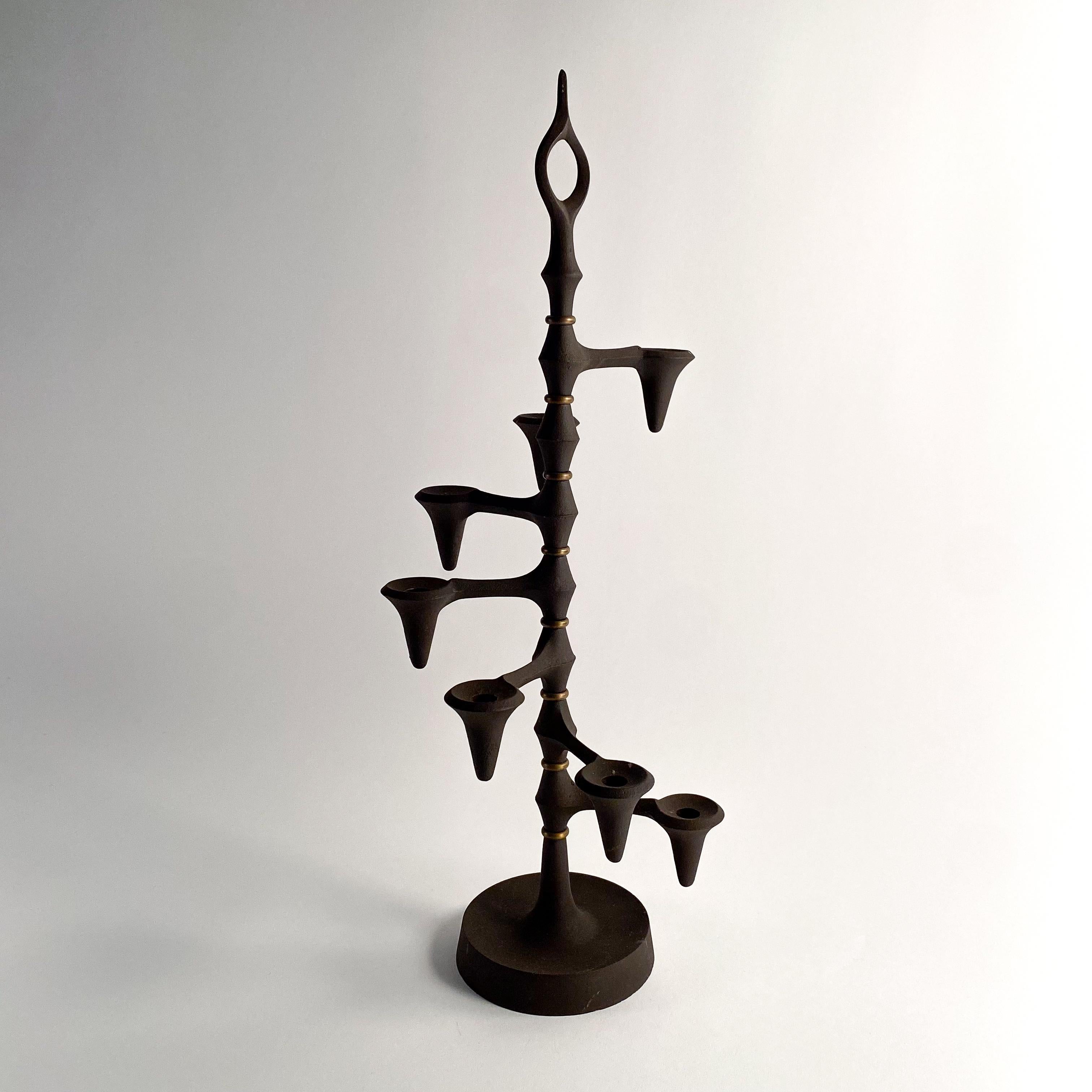 Vintage cast iron candleabra. made in Denmark. Designed by Jens Quistgaard for Dansk. the sprial pattern can be adjusted.