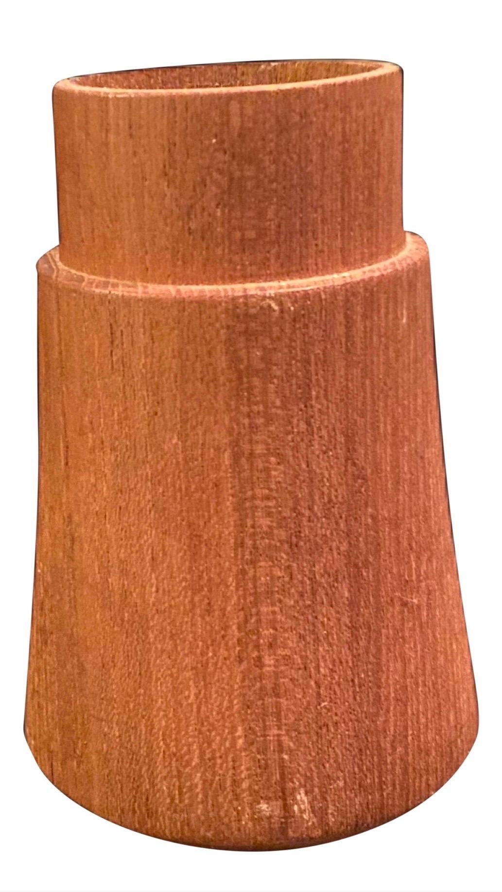Vintage Dansk International Designs Teak Wood & Brass Candle Holder By Jens Quistgaard

Midcentury Danish modern teak and brass candleholder by Dansk. Midcentury handcrafted teak candlestick holder.  This elegant 5.25
