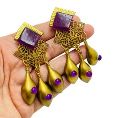 Vintage dark gold purple lucite designer clip on earrings
