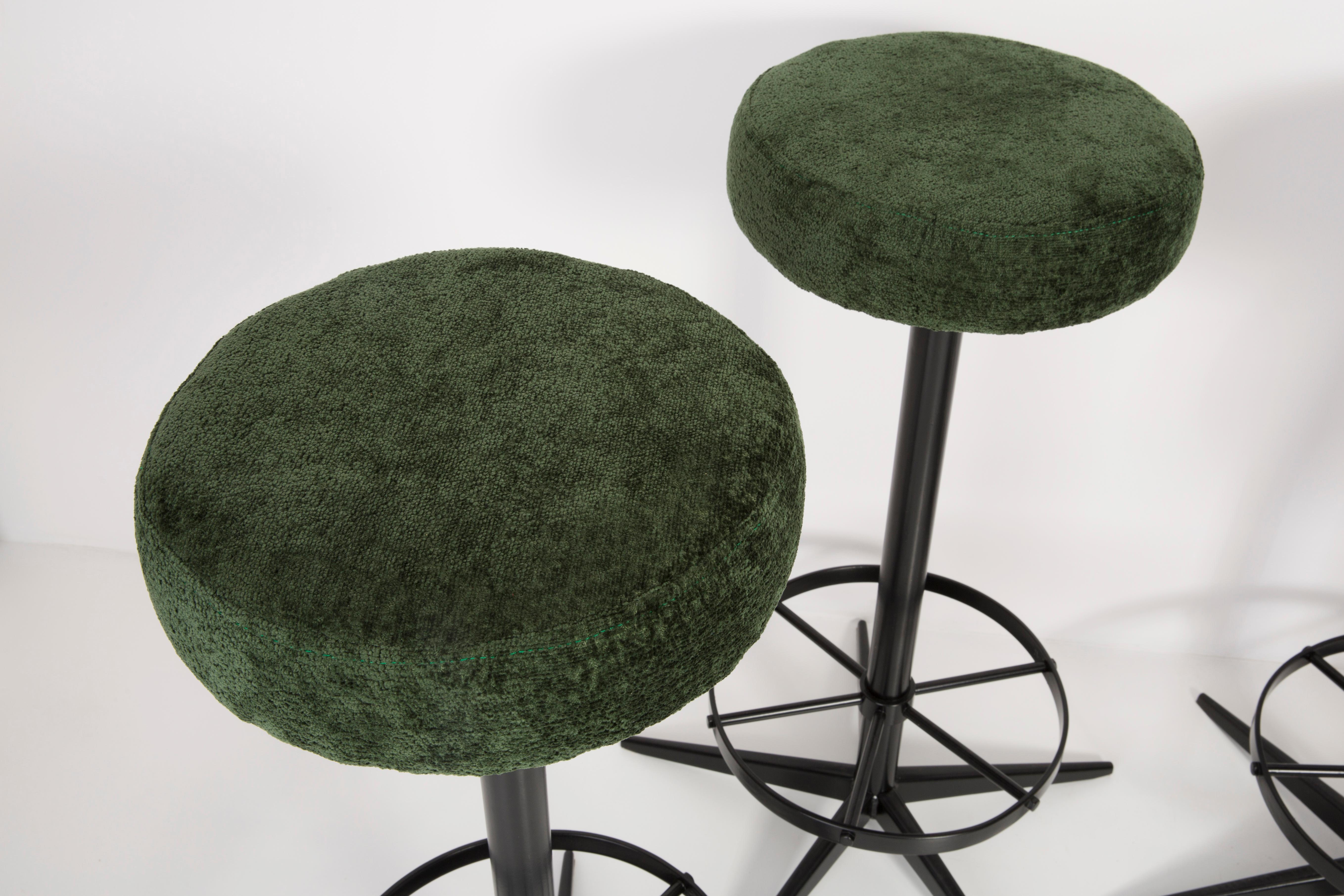 Stool from the turn of the 1960s. Produced in Germany. Beautiful, well crafted dark green Italian upholstery. The stool consists of an upholstered part, a seat and steel black legs. Not regulated. The height is constant.