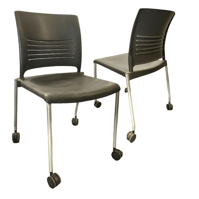 Vintage Dark Grey Plastic Chair with Metal Legs and Casters. $156 Each
 
These plastic chairs are easy to move around and can serve as a desk chair, waiting room, or even as additional seats for guests. They are stackable and their plastic seat and