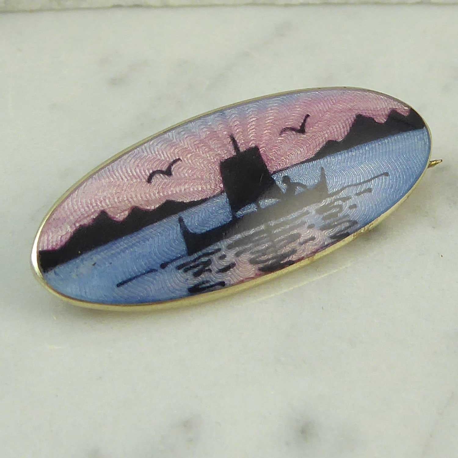 Silver and enamel brooch by renowned Norwegian jeweller, David Anderson.  The scene depicts as sailing boat in soft and gentle colours of sunset.