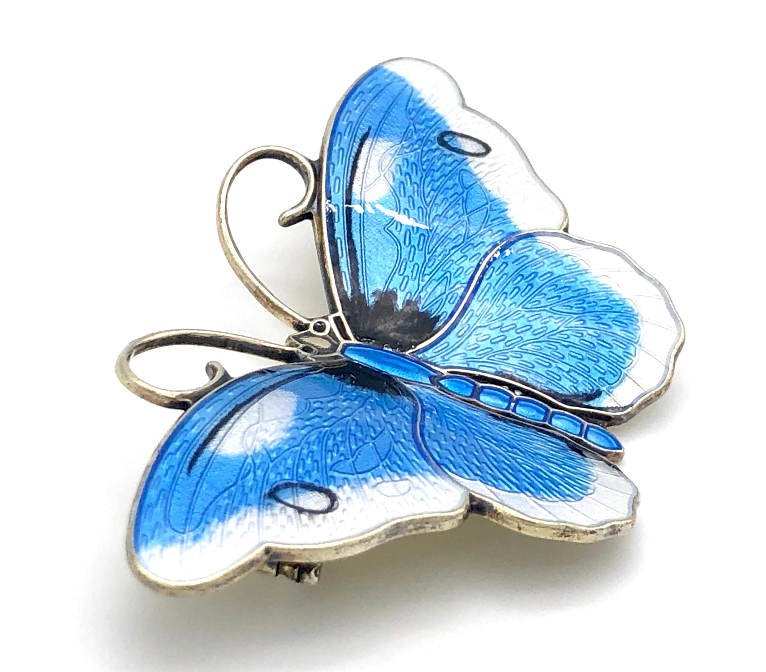 The beautiful fully signed butterfly brooch is painted polychrome enamel on guilt sterlng silver. 