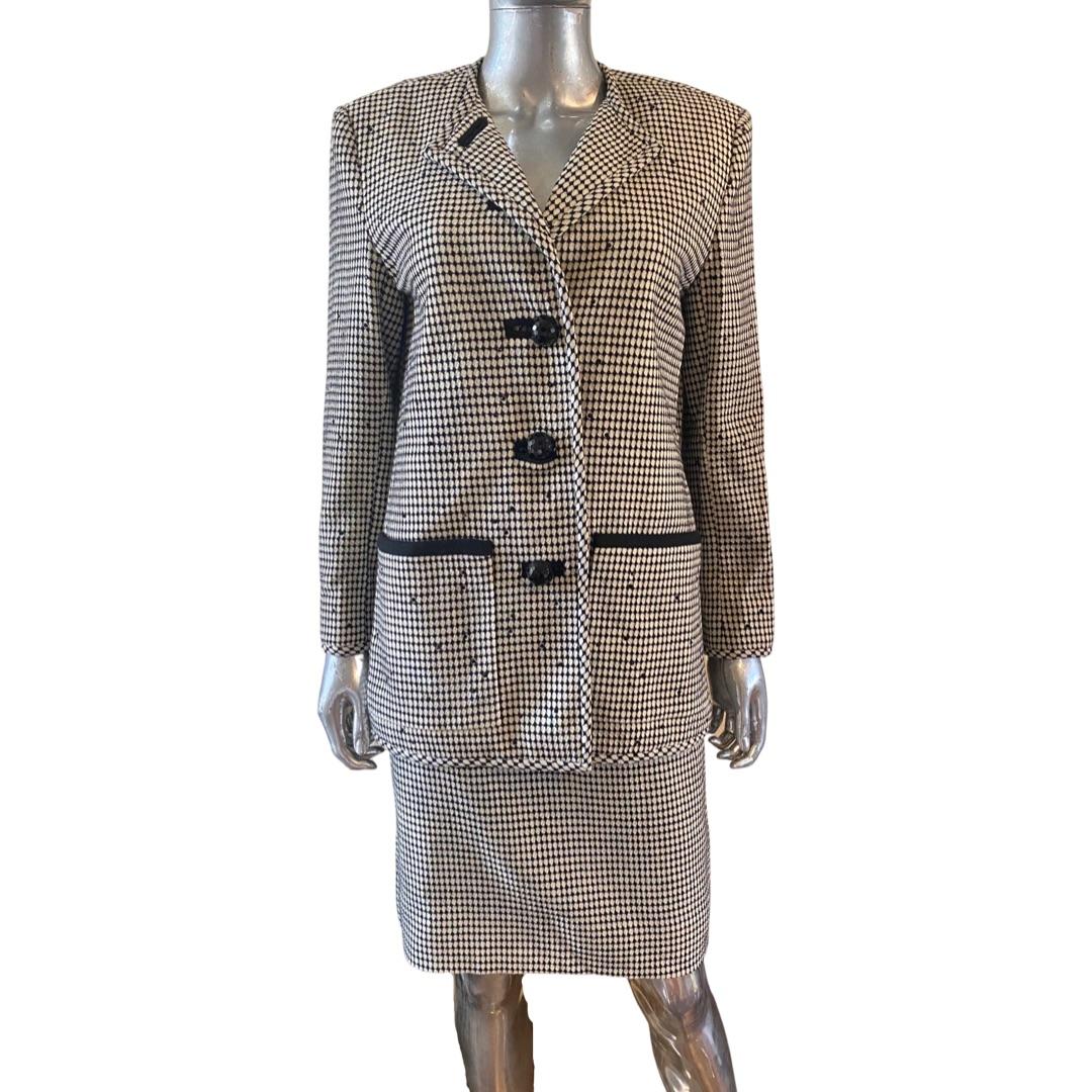 Such a beautiful suit by Los Angeles designer who designed for Fist Ladies (Regan and Ford) and many Hollywood celebrities and Beverly Hills Ladies who lunch. This suit is one of a kind, custom made. The cardigan style jacket is beaded with sparse