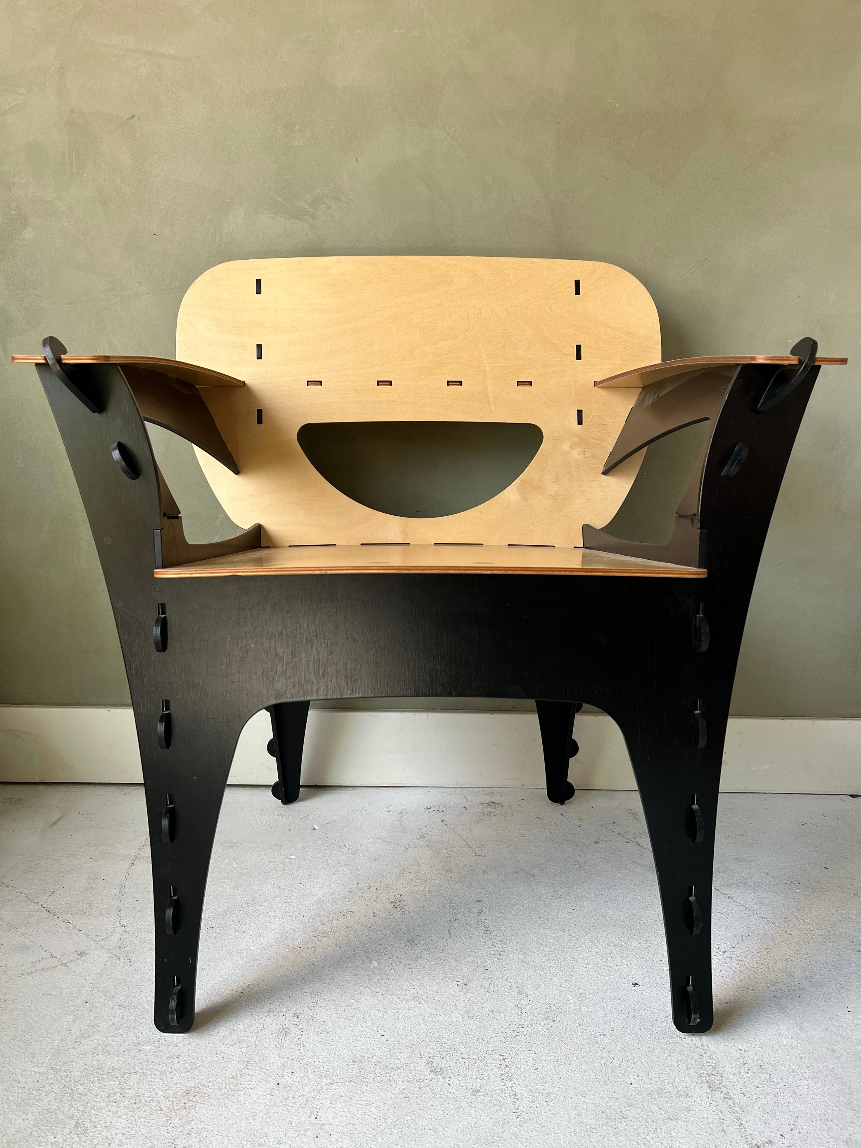 Vintage Puzzle chair by David Kawecki. In great condition with just a few small chips on the legs. Black and natural color combination. Solid construction and a great conversation piece.
