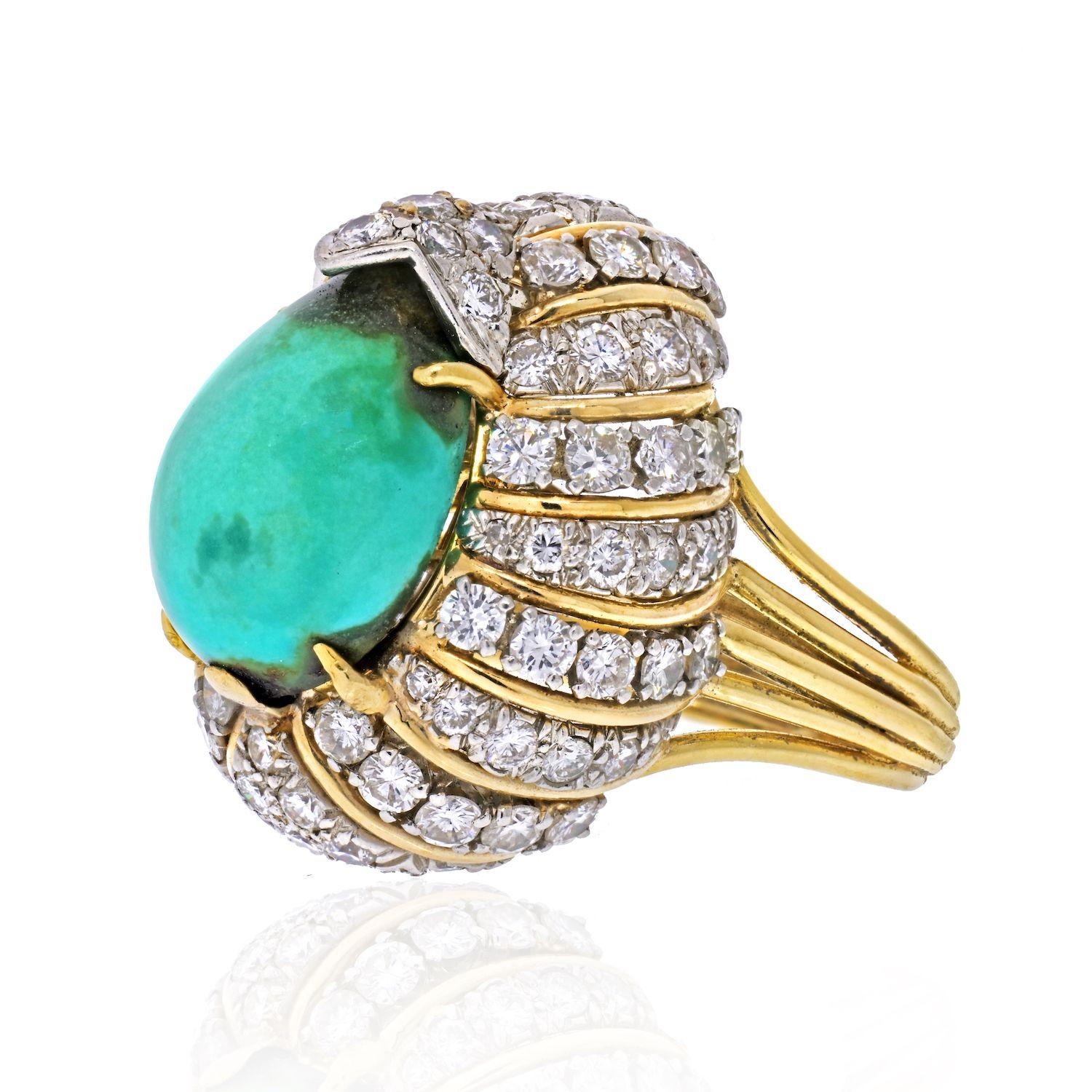 A vintage David Webb platinum and 18K yellow gold pear shape cabochon turquoise ring with round brilliant-cut diamonds. Circa 1970. Turquoise shows signs of discoloration. Please review pictures. 
Turquoise: 15 cts approx.
Diamonds: 1.75 approx.