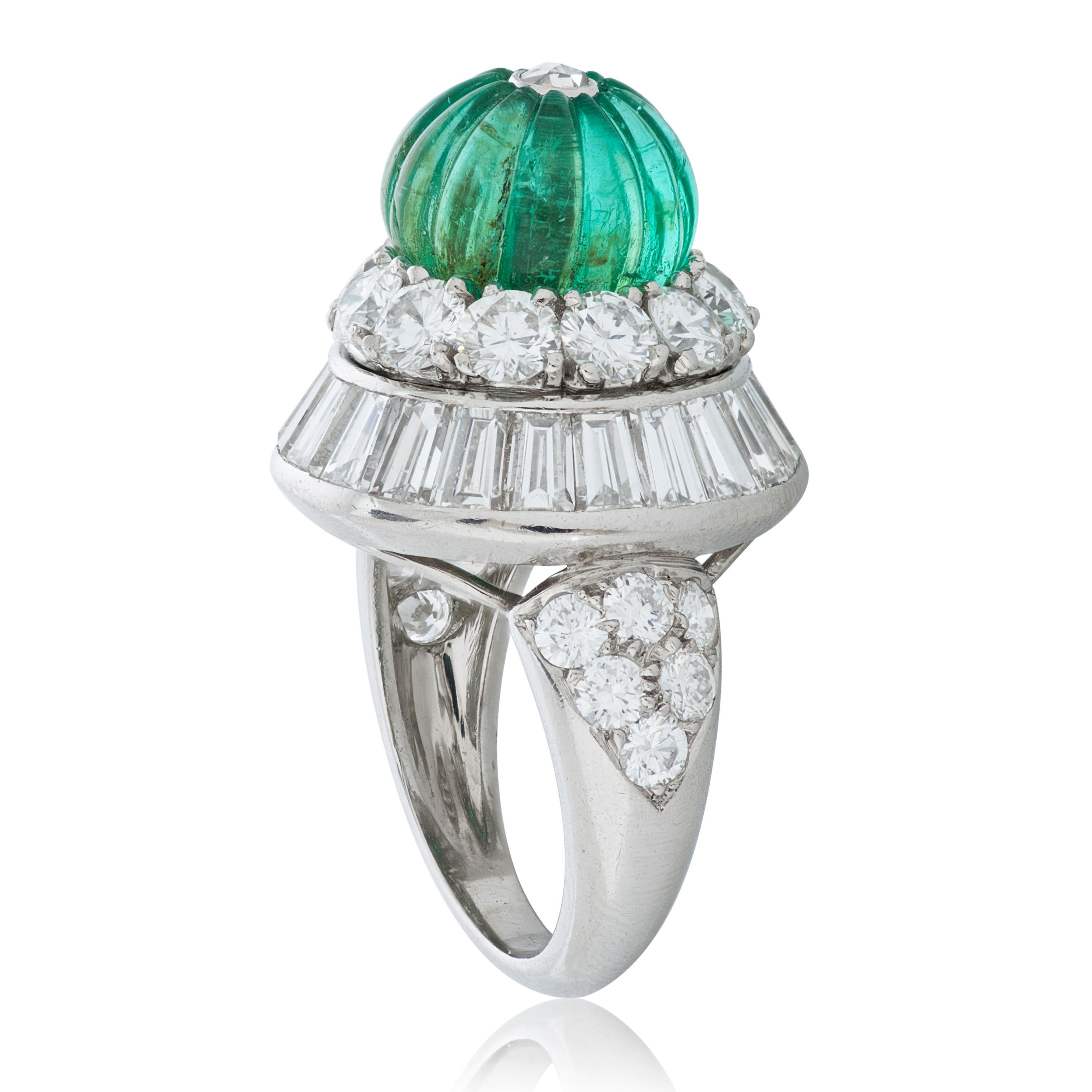 Vintage David Webb fluted emerald bead and diamond ring in platinum and 18k white gold, accompanied by David Webb certificate of authenticity and David Webb box.  

This David Webb ring features a 5.10 carat emerald bead carved in a fluted pattern. 