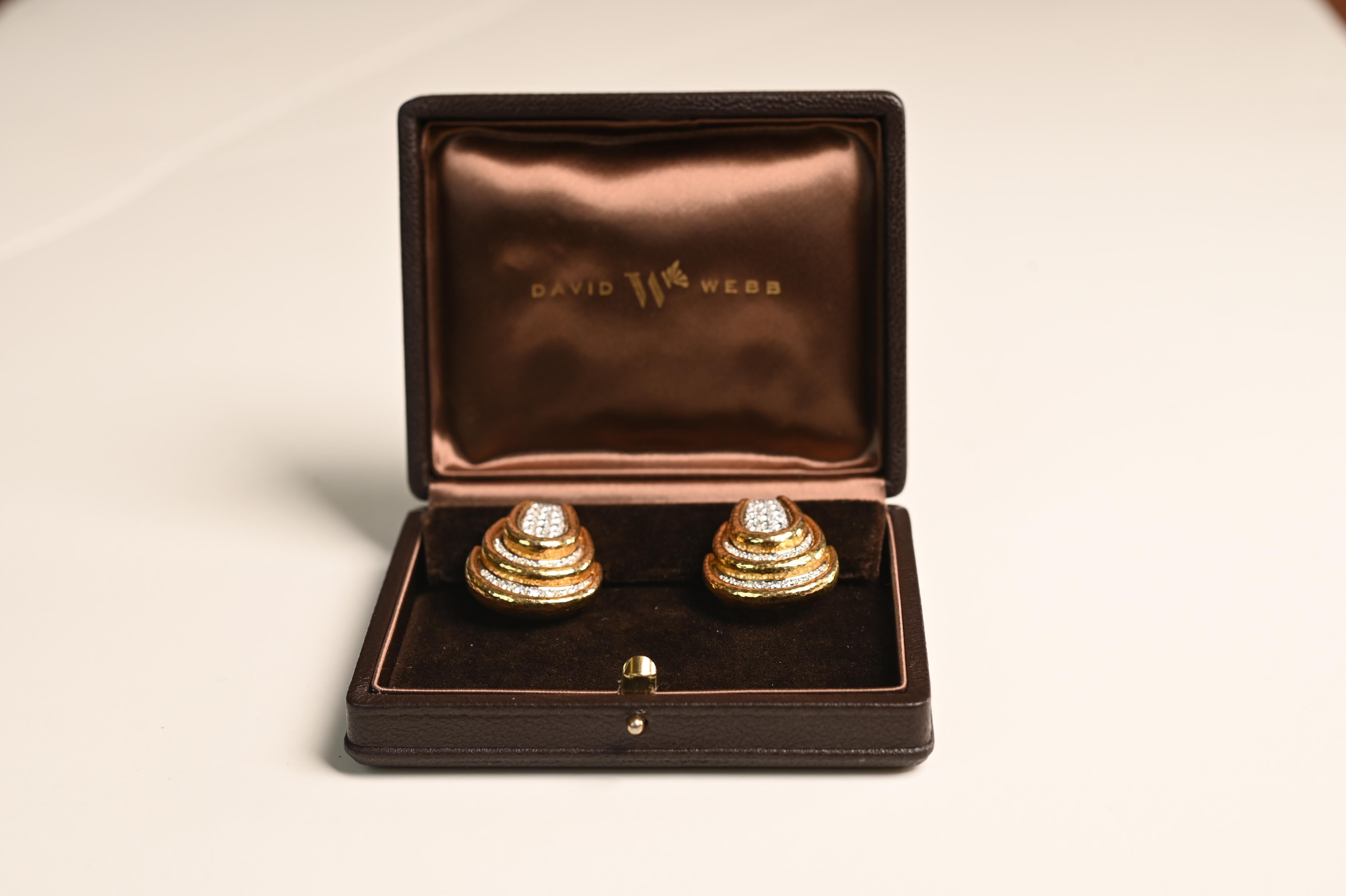 A striking pair of vintage David Webb earrings, showcasing the bold yet elegant aesthetic the designer is celebrated for. These earrings feature pavé-set diamonds set in rich platinum, with an approximate total diamond weight of 2.9-carats. The