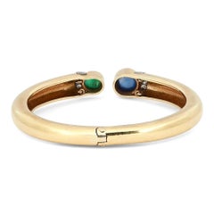 Bracciale a cuffia vintage David Webb con smeraldi, zaffiri e diamanti, in oro giallo 18 carati